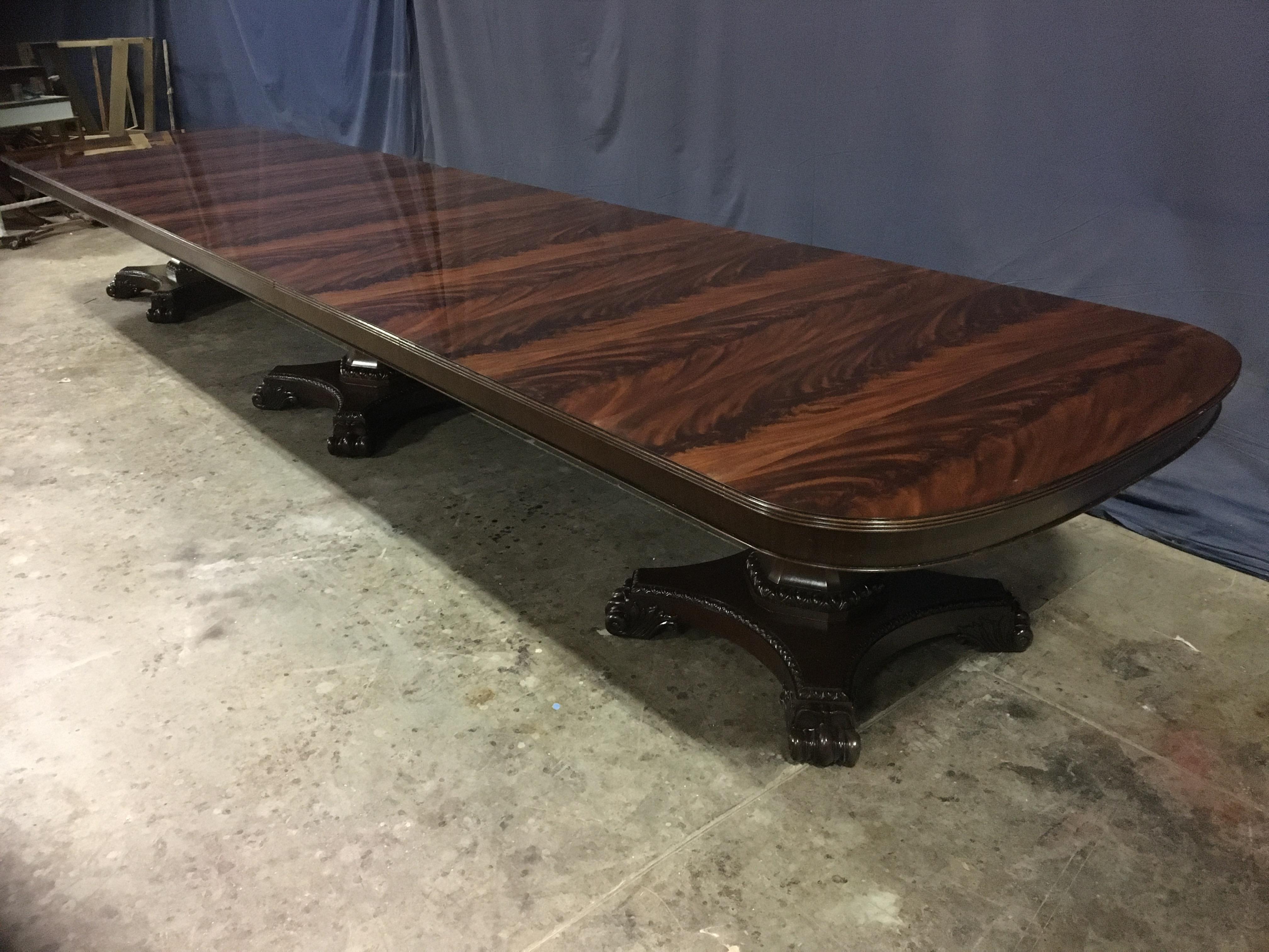 This is a made-to-order large traditional mahogany banquet/dining table made in the Leighton Hall shop. It features a field of reverse slip-matched swirly crotch mahogany from West Africa. It has “D” shaped ends with a solid mahogany three beaded