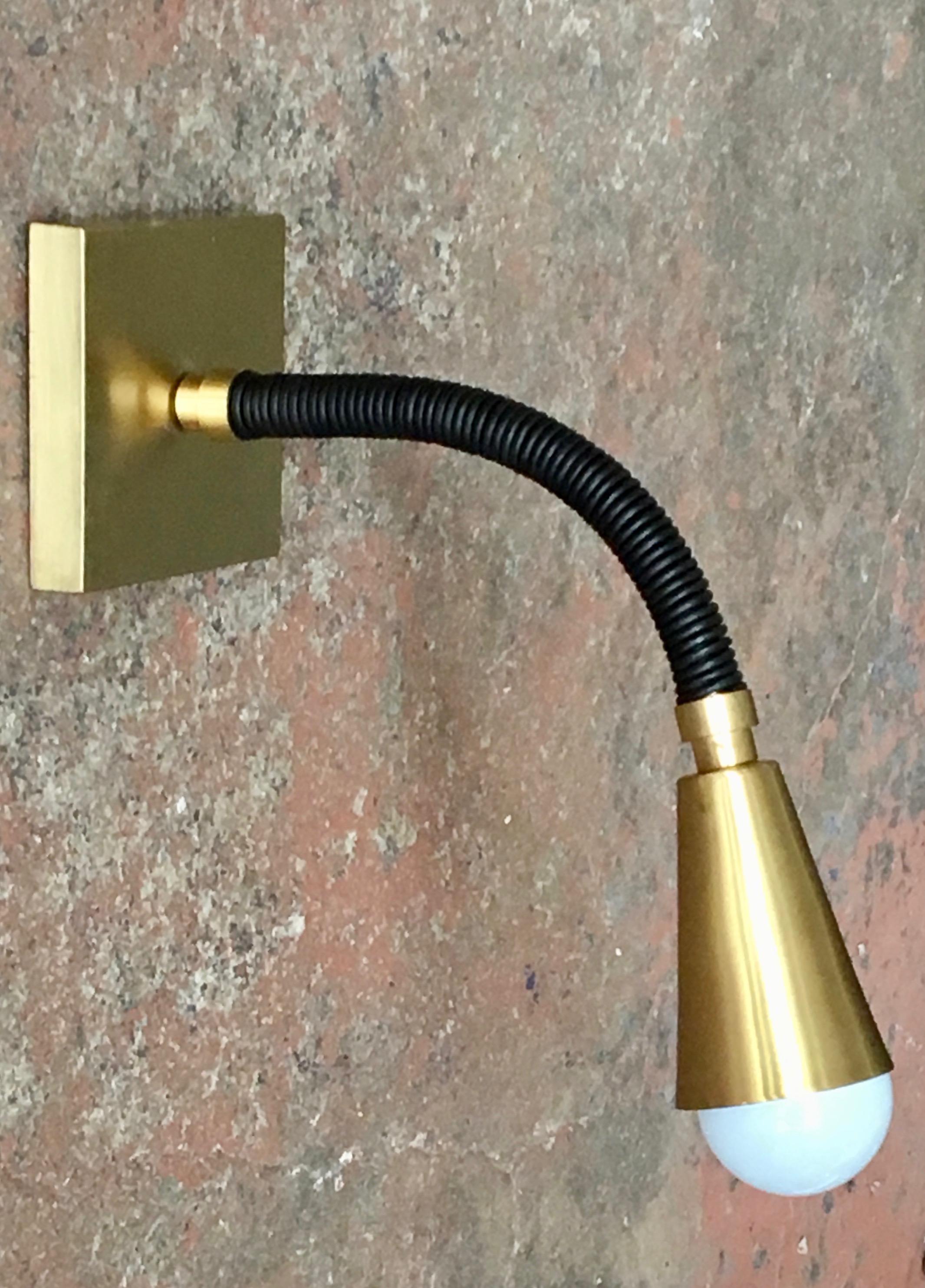 Adjustable swing arm reading light wall sconce, leather arm and solid brass fittings. Meander Lighting comes in over 30 leather colors, and many custom options are available. Measurements depend on how the arm is posed. As shown, leather arm is 12