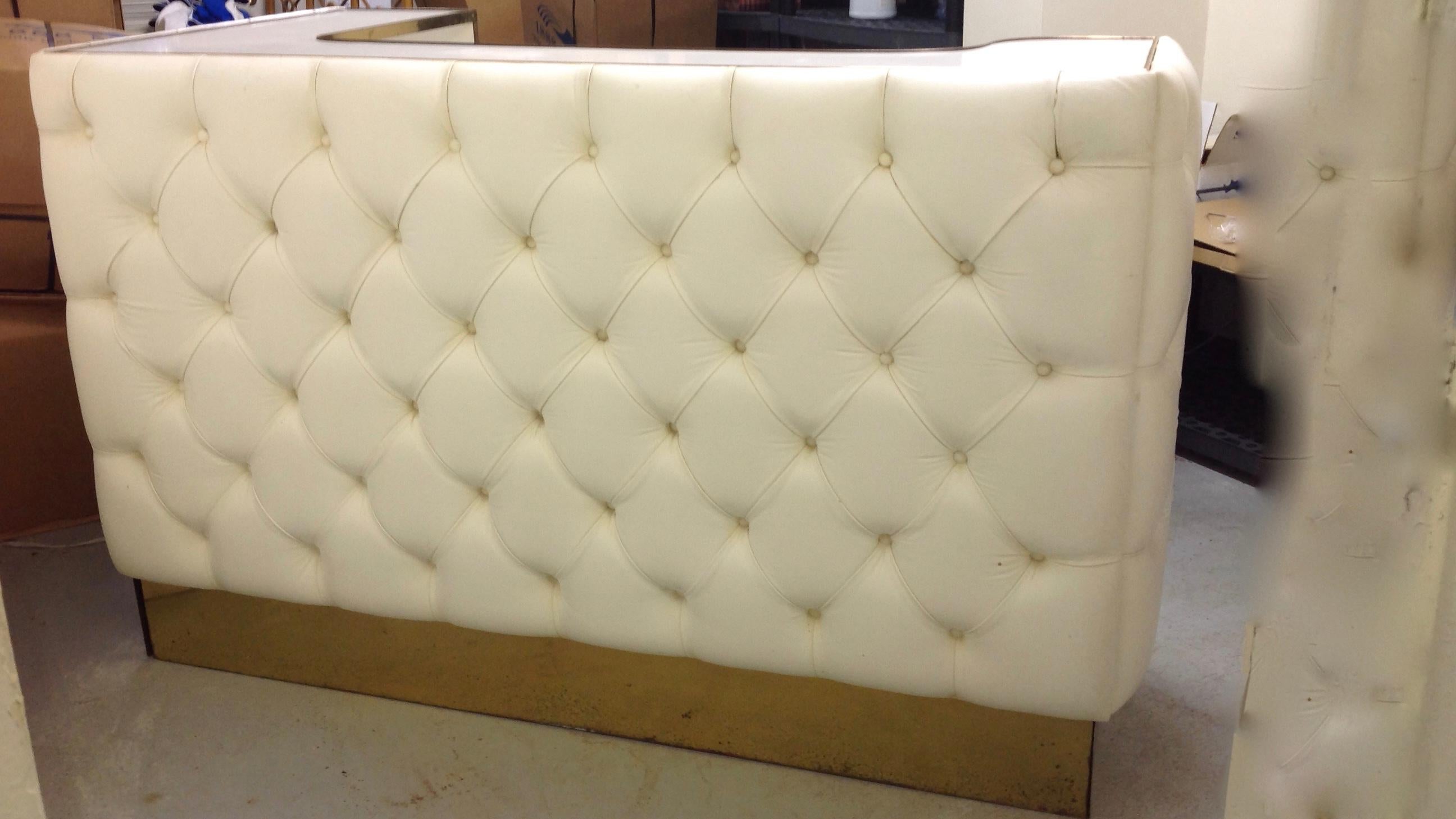 One of a kind with plush tufted leather front panels.
The bar is generously scaled and fitted with interior shelving for glass ware and bottles. The
smaller side is 35