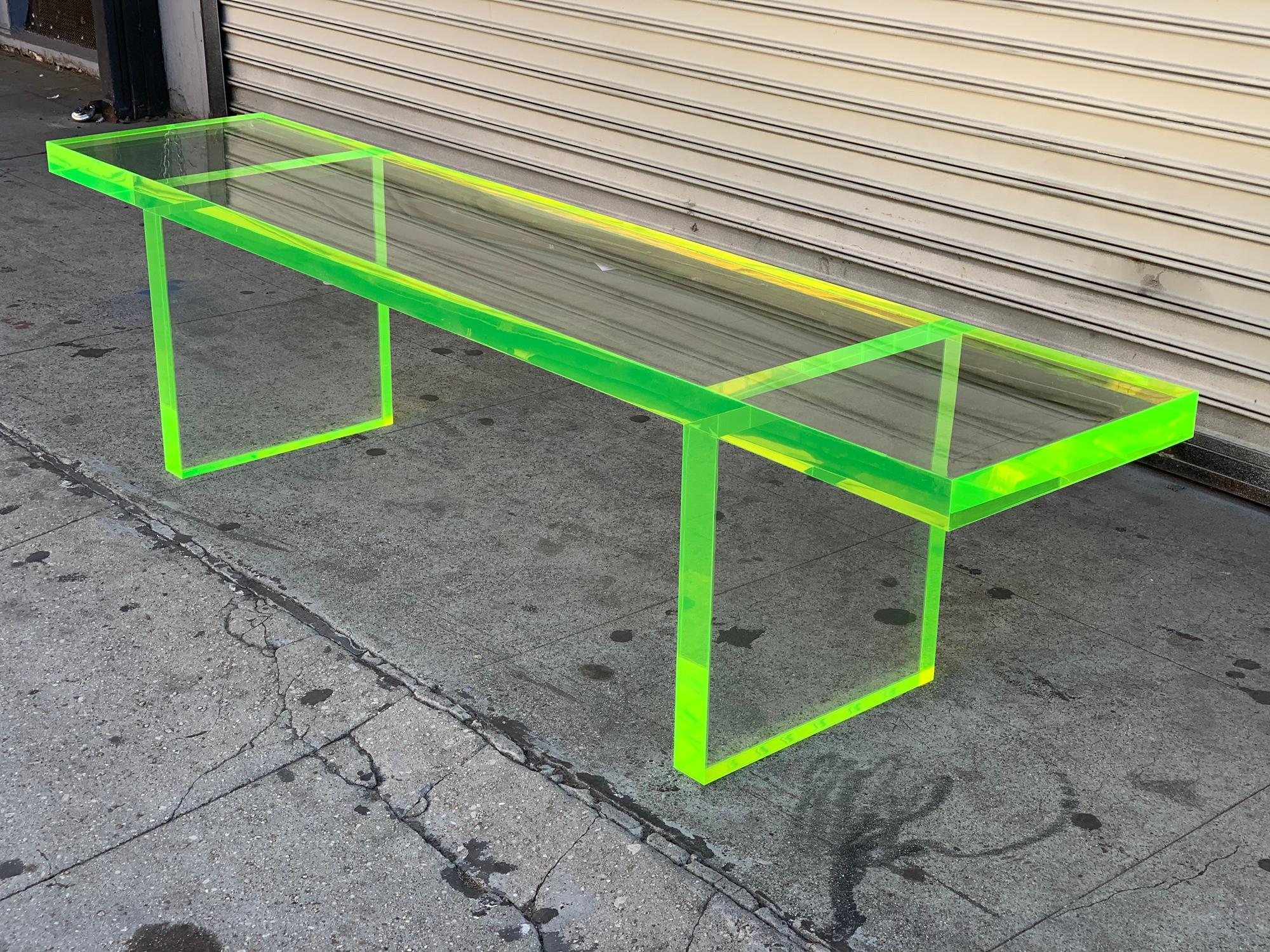 Introducing the Fluorescent Green & Clear Lucite Bench by Amparo Calderon Tapia, a stunning addition to any contemporary living space. Crafted from high-quality Lucite material, this bench is handcrafted using a 2 inches thick clear Lucite and