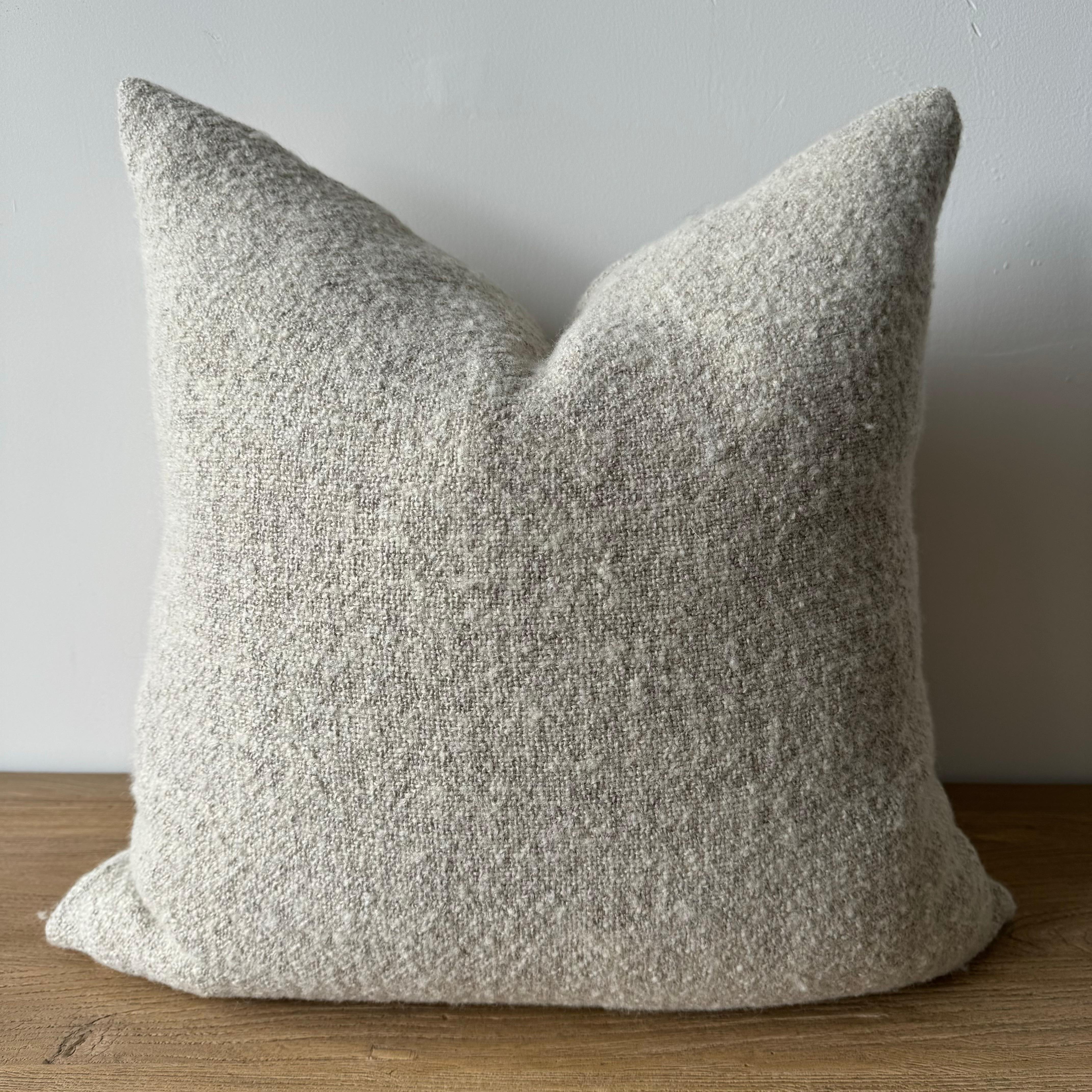 A soft natural flax oatmeal and beige woven fibers in a stonewash finish create this luxurious soft pillow. Sewn with an antique brass zipper closure and overlocked edges.
Includes a down/ feather insert.
Size: 22 x 22
-51% Linen
-39% Wool
-10%