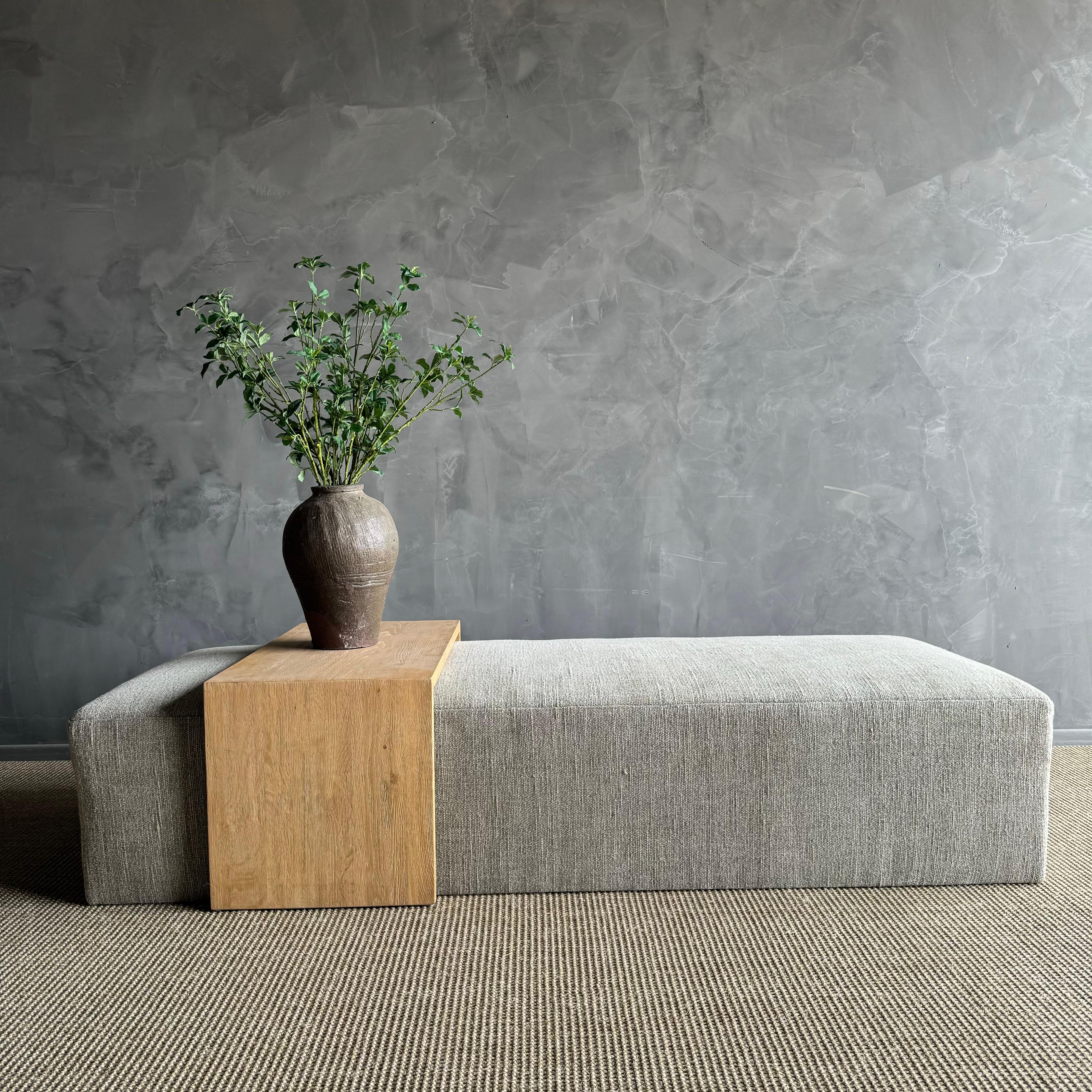 The Alora Ottoman is Made-to-Order. This cocktail ottoman shown with a waterfall oak table, that is custom made with dovetail, mortis & tenon joinery.

Shown in a heavy weight woven linen, color is a light kaki neutral

The table is finished by hand