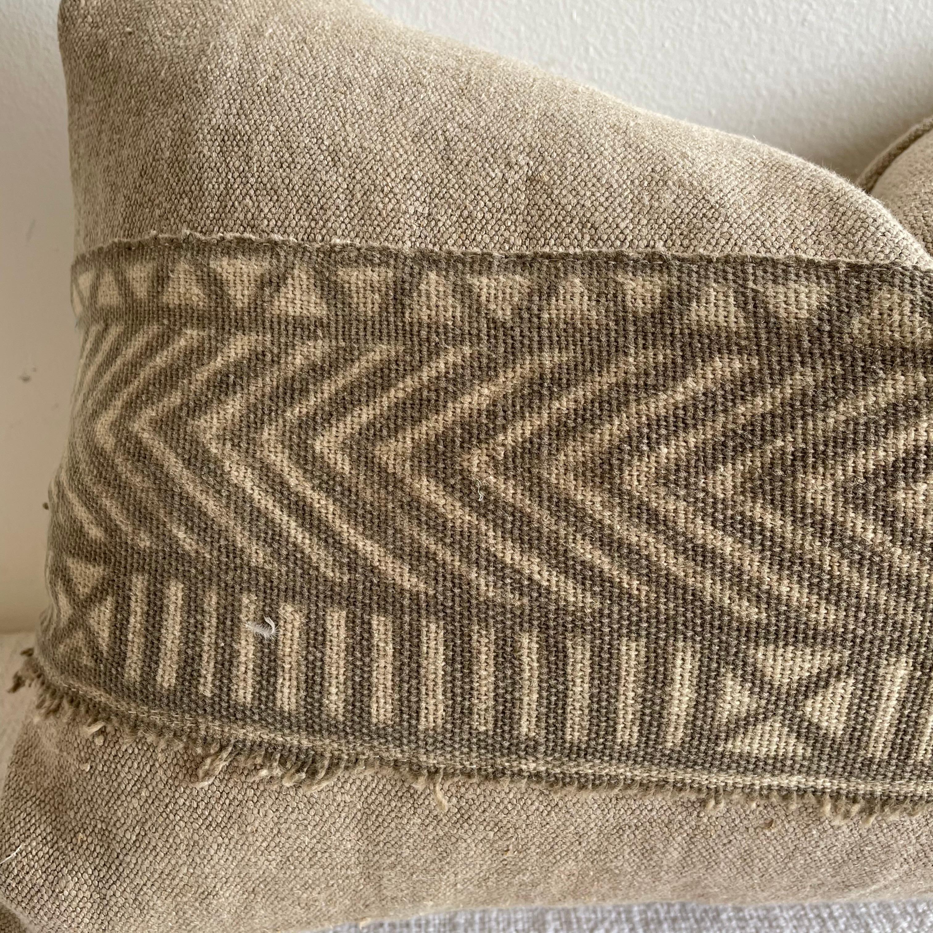 This vintage textile pillow face features a batik trim in the center, natural flax linen colored background with original nubby texture . The backing is 100% Belgian linen in natural linen. Our pillows are constructed with vintage one of a kind