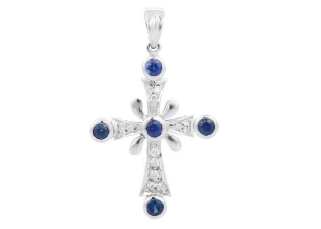 Natural blue sapphire cross pendant in 18K gold. It has square cut sapphires studded with diamonds that completes your look with a decent touch. Pendants are used to wear or gifted to represent love and promises. It's an attractive jewelry piece