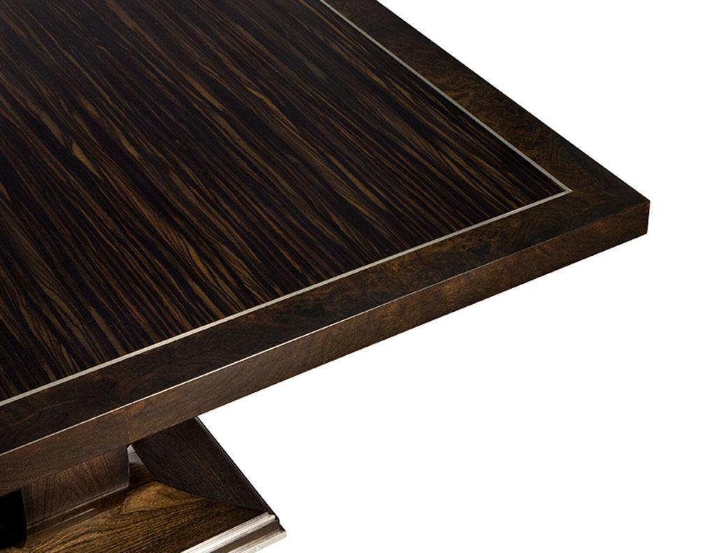 Custom Macassar and walnut dining table. Custom made art deco style Macassar ebony and burled walnut square dining table. Featuring metal inlay and space saving shape and design, perfect for condos and smaller rooms.

Price includes complimentary