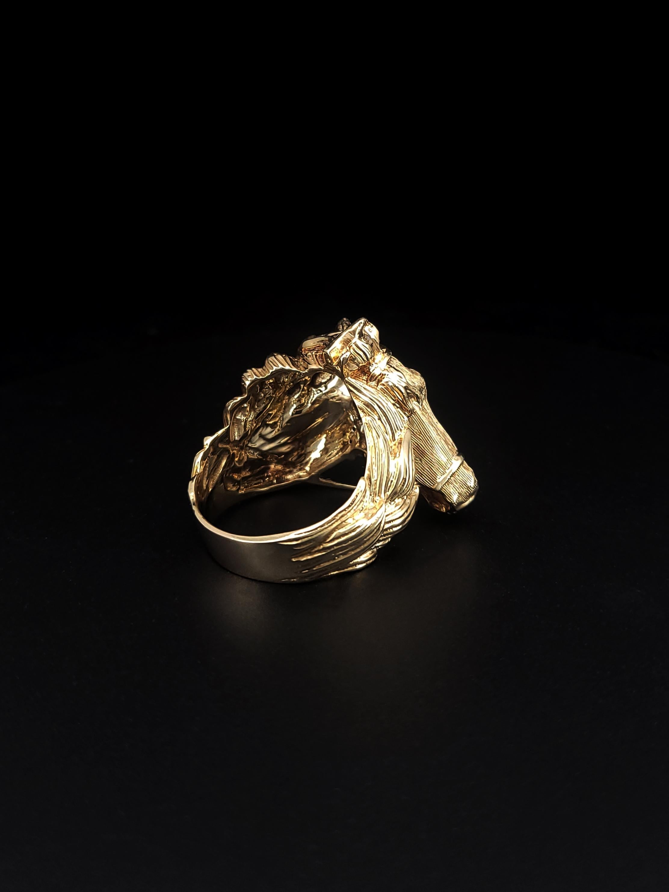 A custom-made antique horse ring, embellished with diamonds.

-Material: 14k Gold
-Size: 12
-Diamonds: VS G
-Diamond Weight: 0.35ct
-Face Thickness: 27.3mm
-Shank Thickness: 6.3mm
-Width: 27.4mm
-Weight: 22 grams

Retail: $6,500