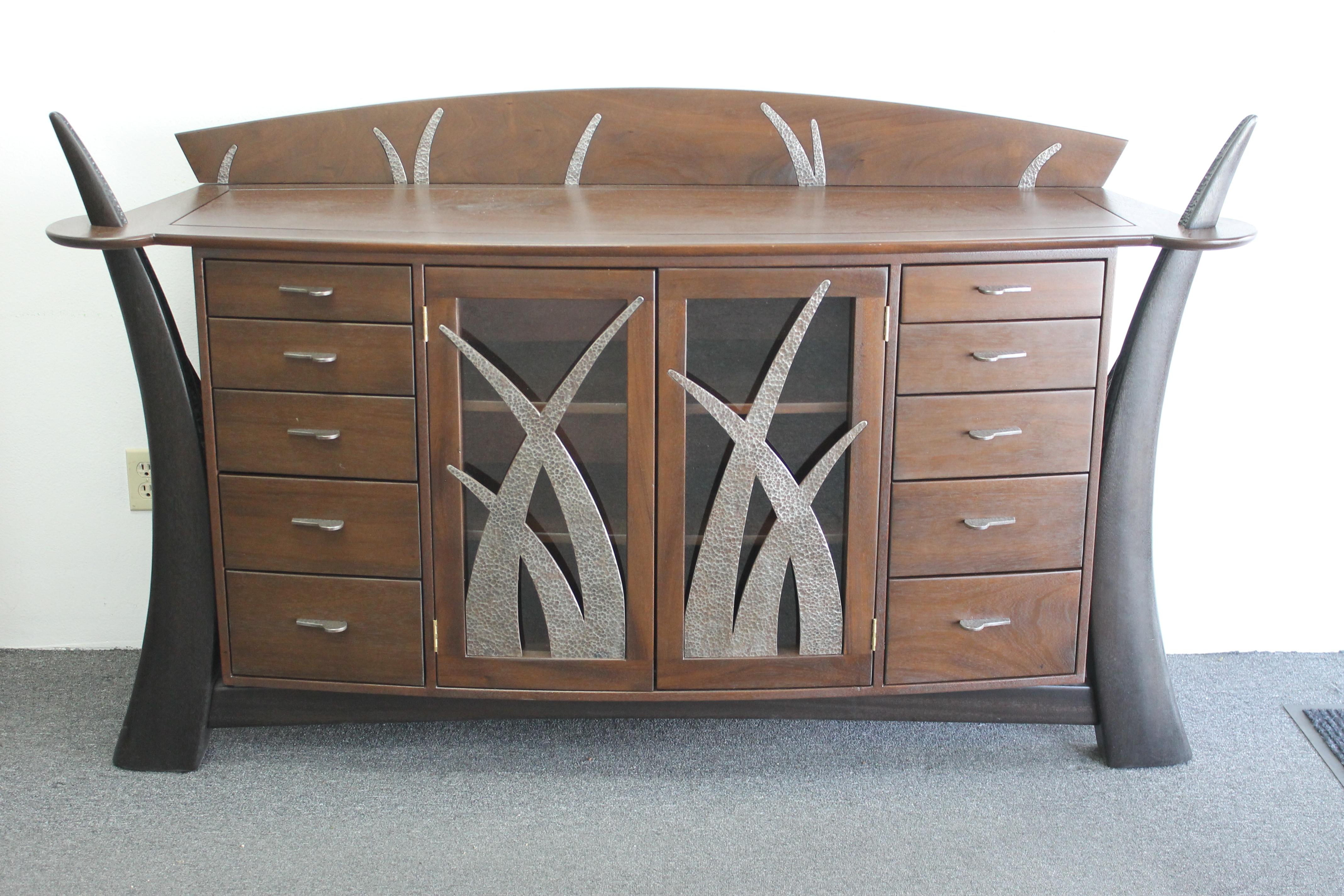 An impressive one-of-a-kind custom built sideboard featuring dramatic tusk shaped 