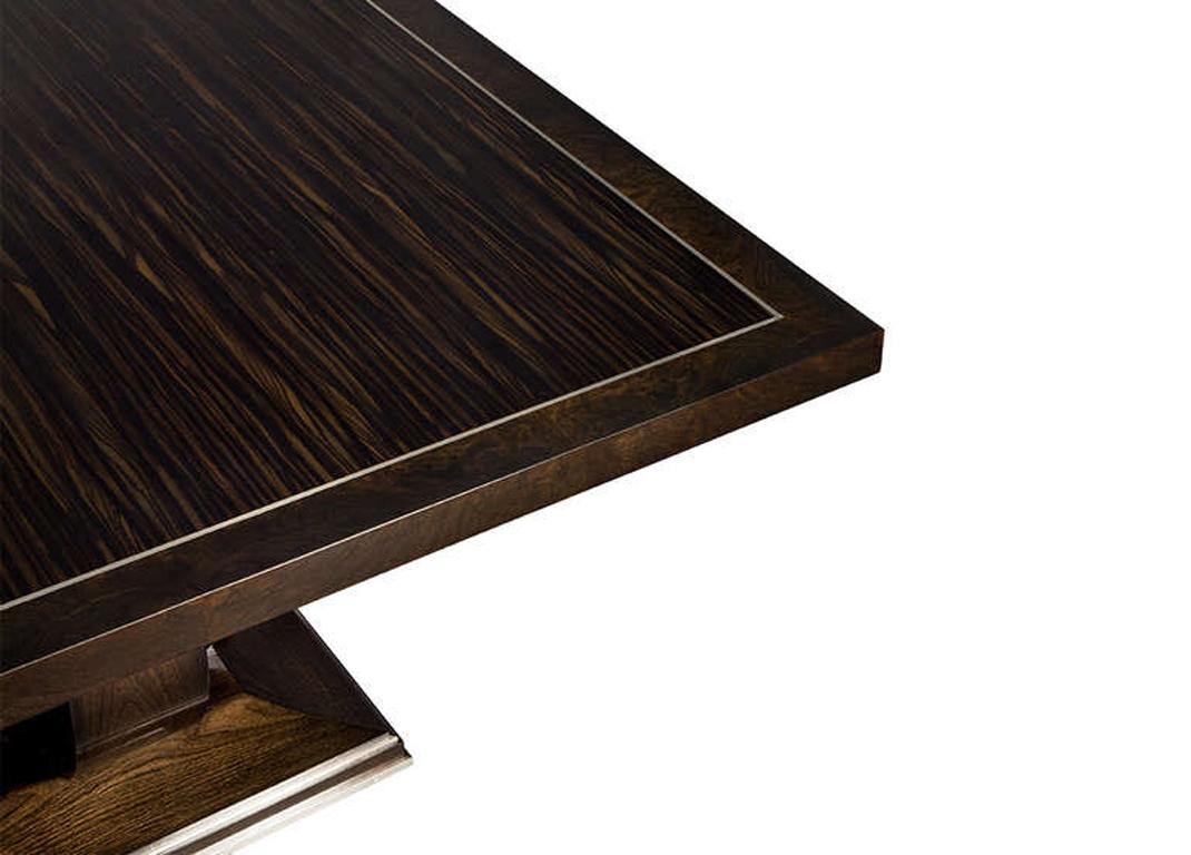 Custom Art Deco Macassar ebony and burled walnut dining table with polished nickel inlay.
Custom made and handcrafted by Carrocel in Toronto Canada.
Price includes complimentary curb side delivery to the continental USA.