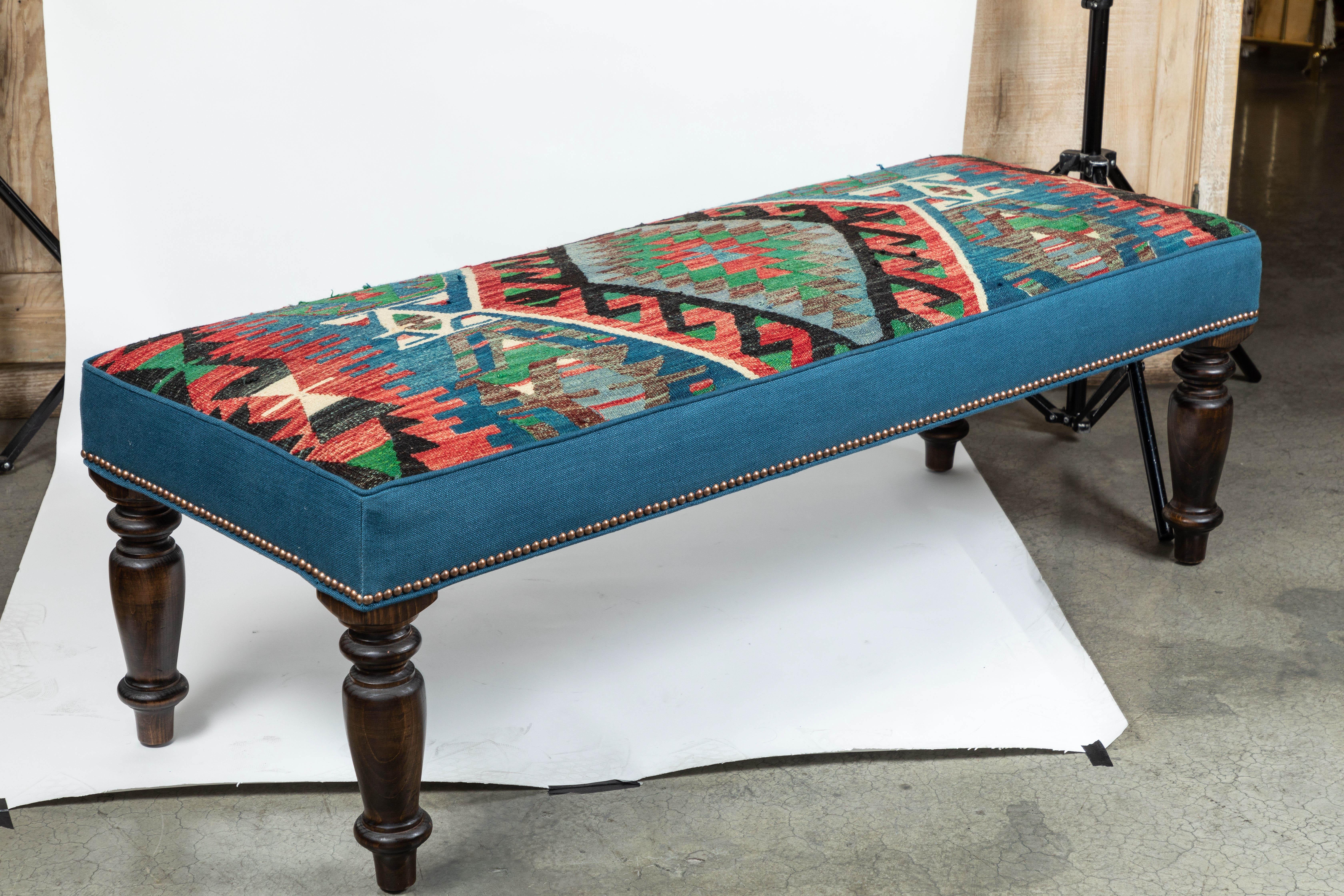 Custom-made bench with wool Kilim & Belgian linen on sides, finished with nailhead trim.