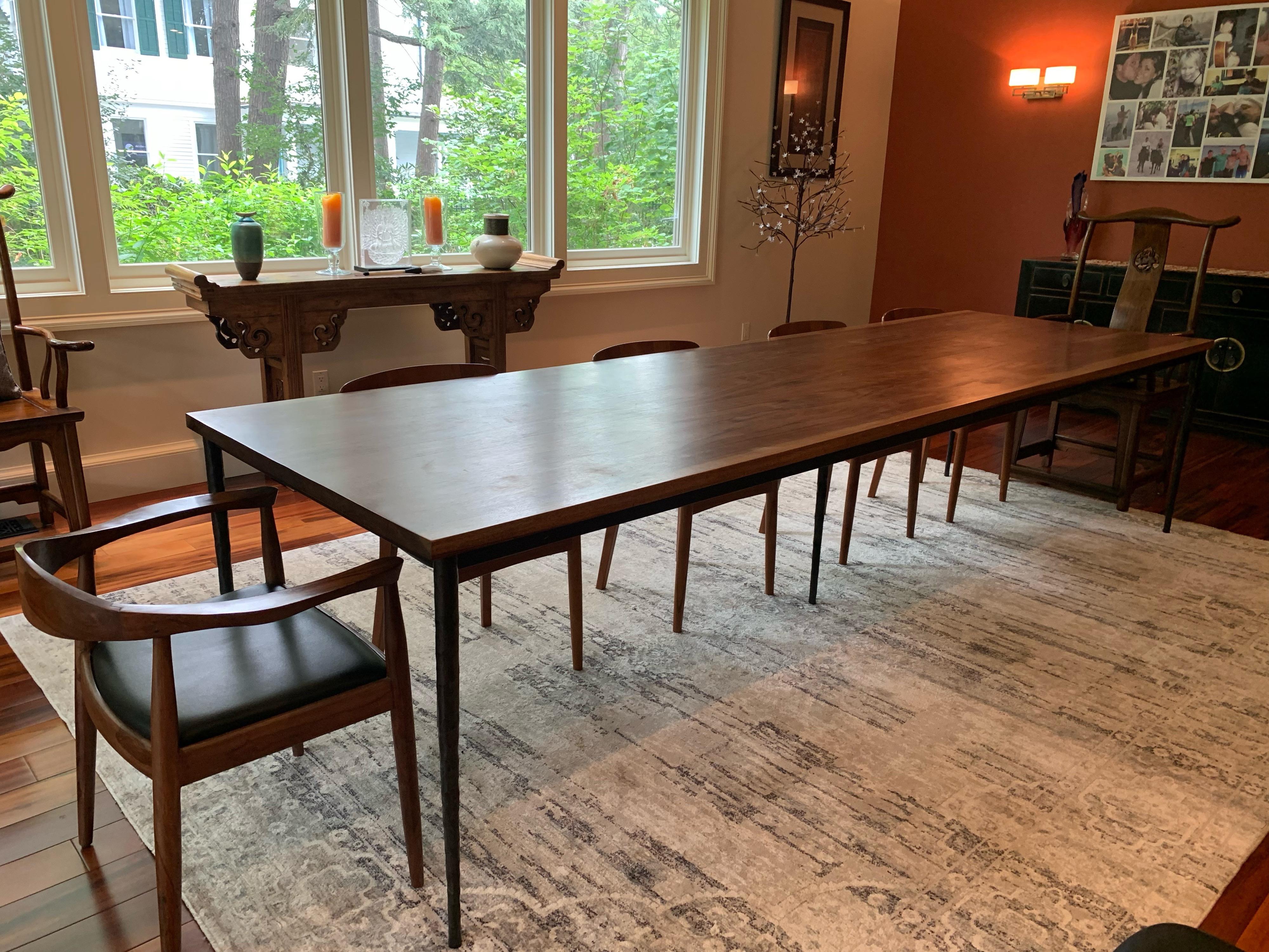 Custom-made Brazilian walnut & steel hammered leg long dining table from ABC Carpet & Home
Steel Hammered legs give a beautiful contemporary look. The Brazilian Walnut grains are exhibited so beautifully in this extra long table. Light use, very