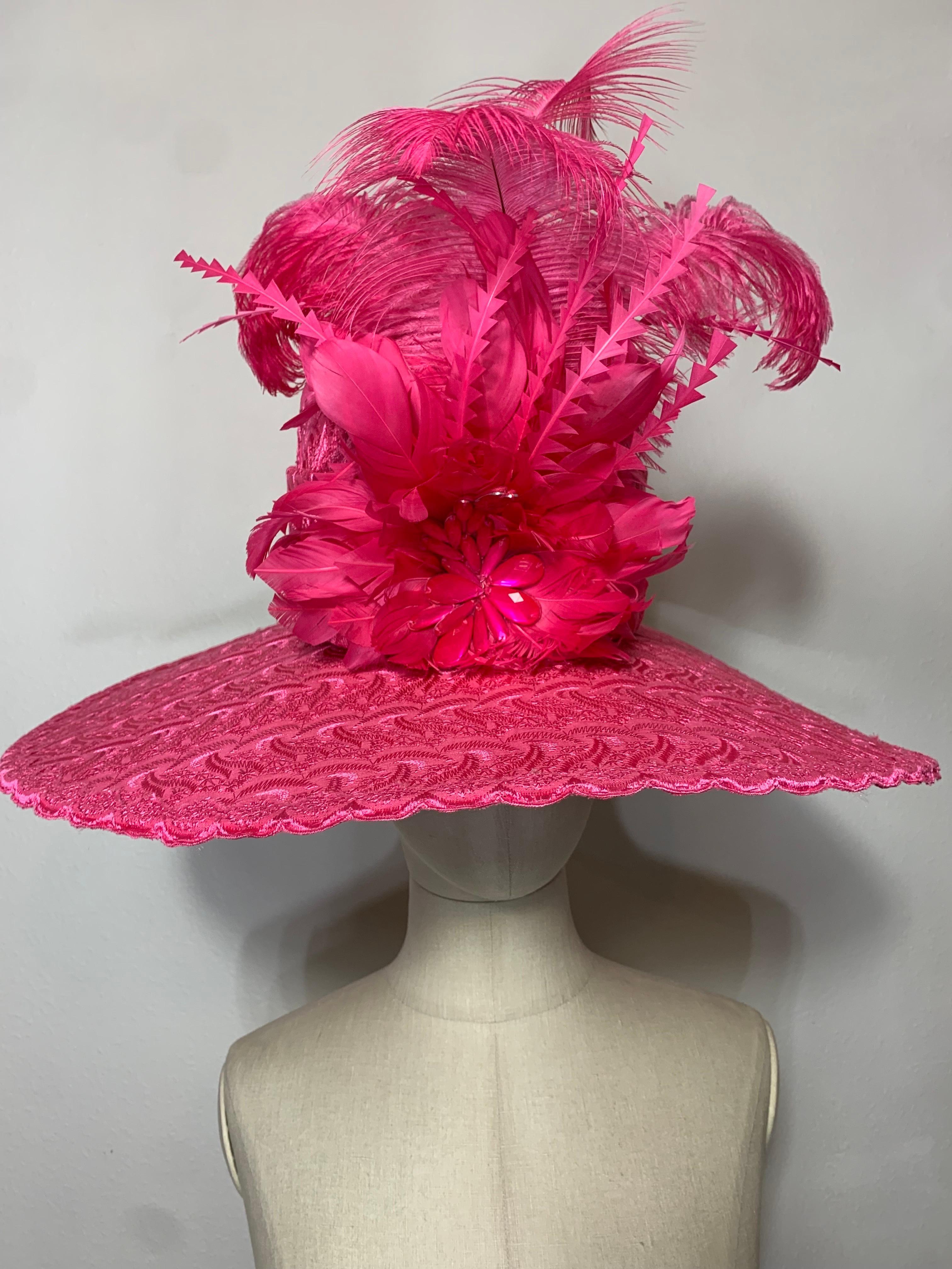 Custom-Made by Suzanne Couture Millinery NY. Spring / Summer. Brilliant Pink Embroidered Cotton Eyelet Fabric Wide-Brimmed Hat:  Tall body, rounded crown hat with wide coordinating fabric band, dyed to match ostrich and rooster feathers clipped and