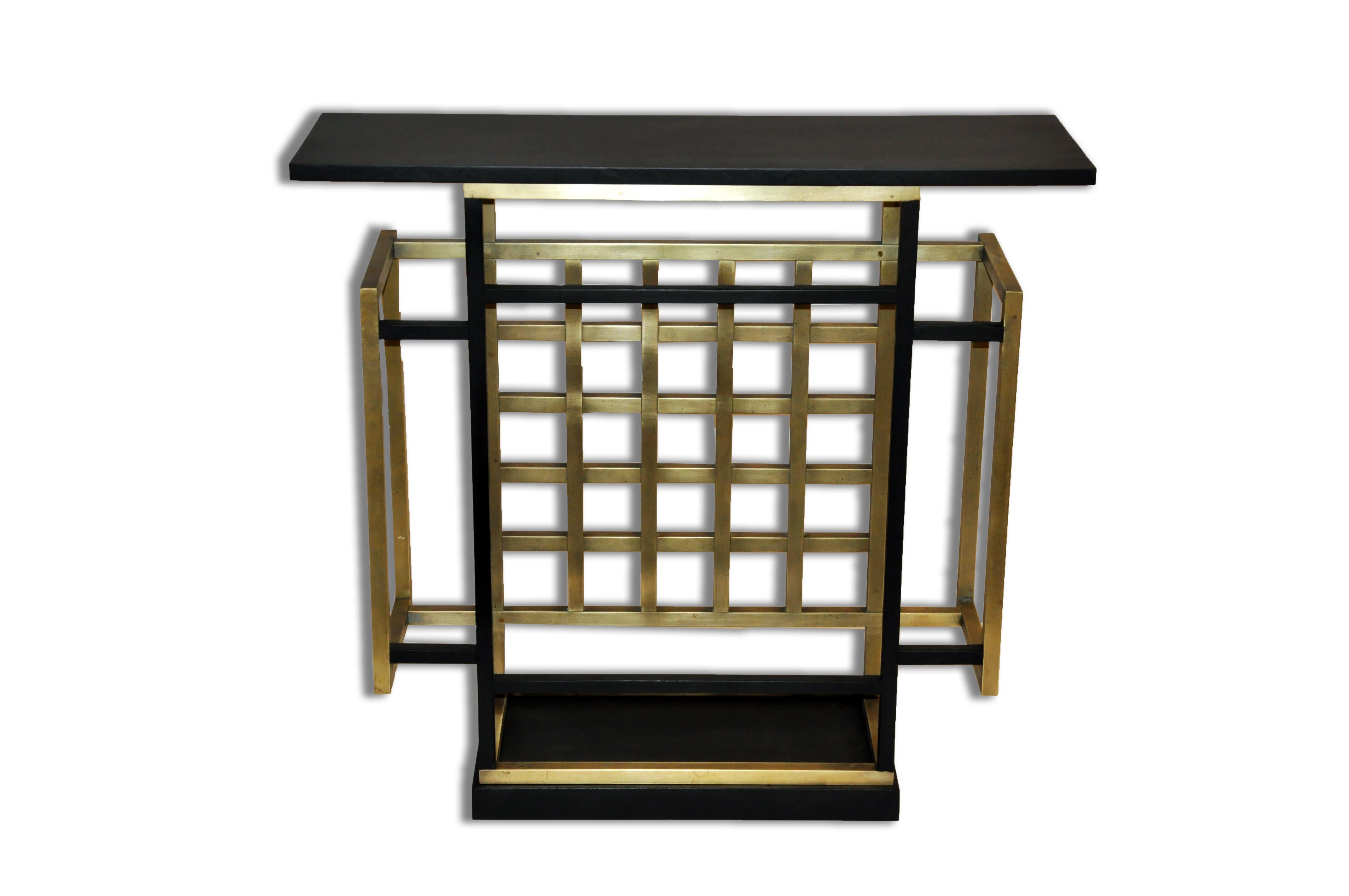 This Mid-Century Modern low table is a handsome convergence of both materials and shapes. Pulling from the Hollywood Regency style of mixed metal and glass, the thick-cut translucent top surmounts the grate-form base. While squares are a primary