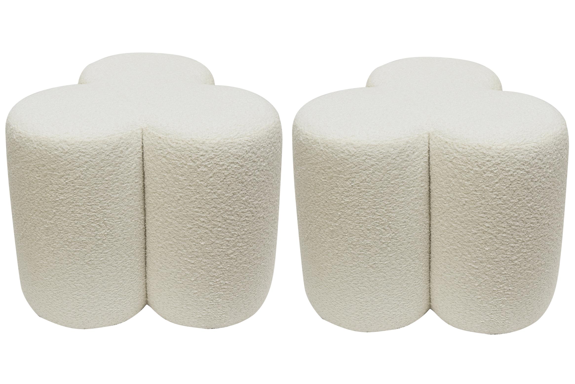 This pair of fabulous custom made limited edition modern benches or ottomans are coined the Cloud Series. They have never been used and are upholstered in a thick large off white fine boucle fabric that is so chic! The materials are wood, dacron and