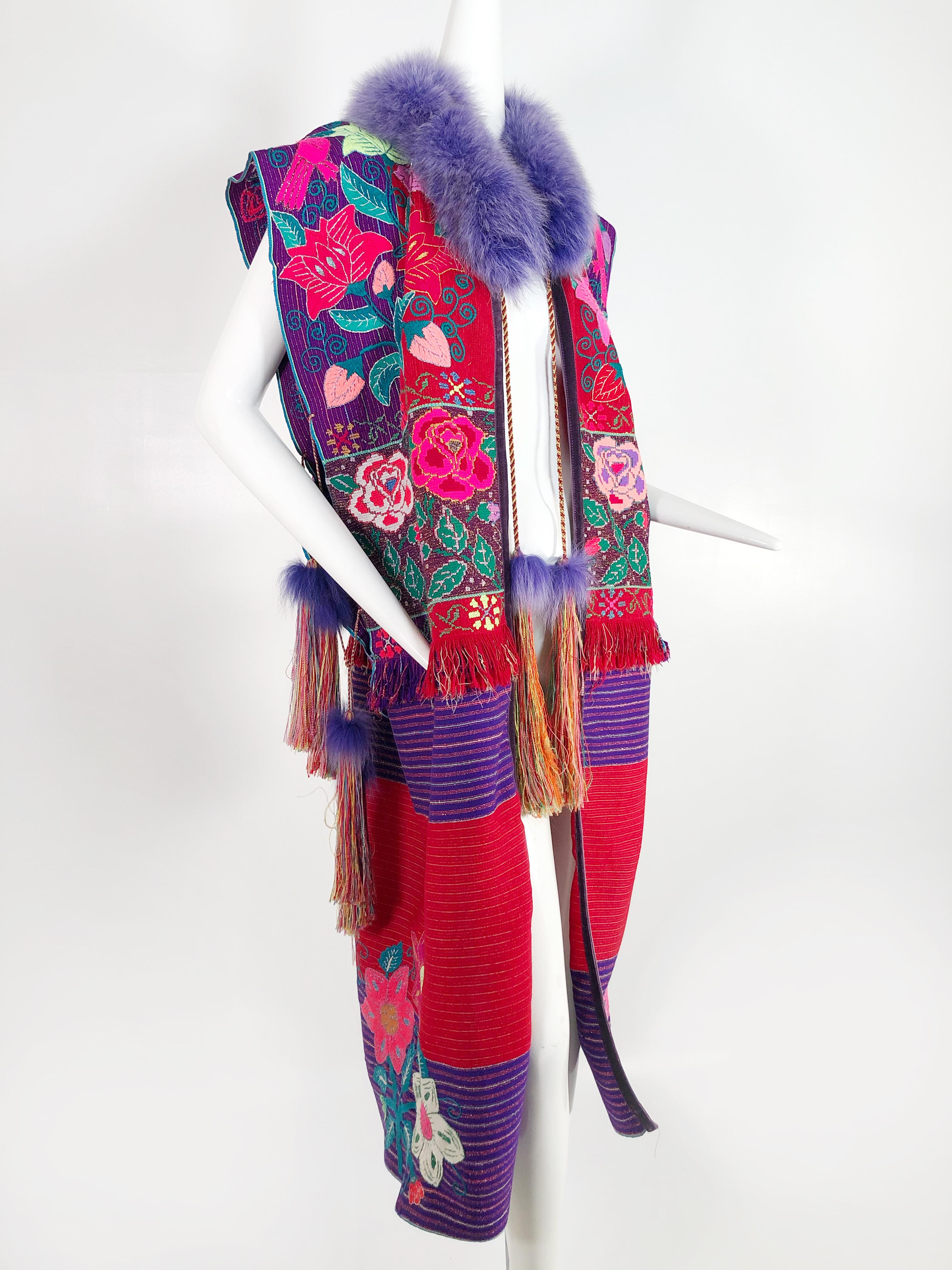 Custom-made colorful folkloric vestment of authentic vintage Mexican textiles with lavender fox fur collar and tassel trim. Front and side ties. Cotton/rayon blend. Unlined. 