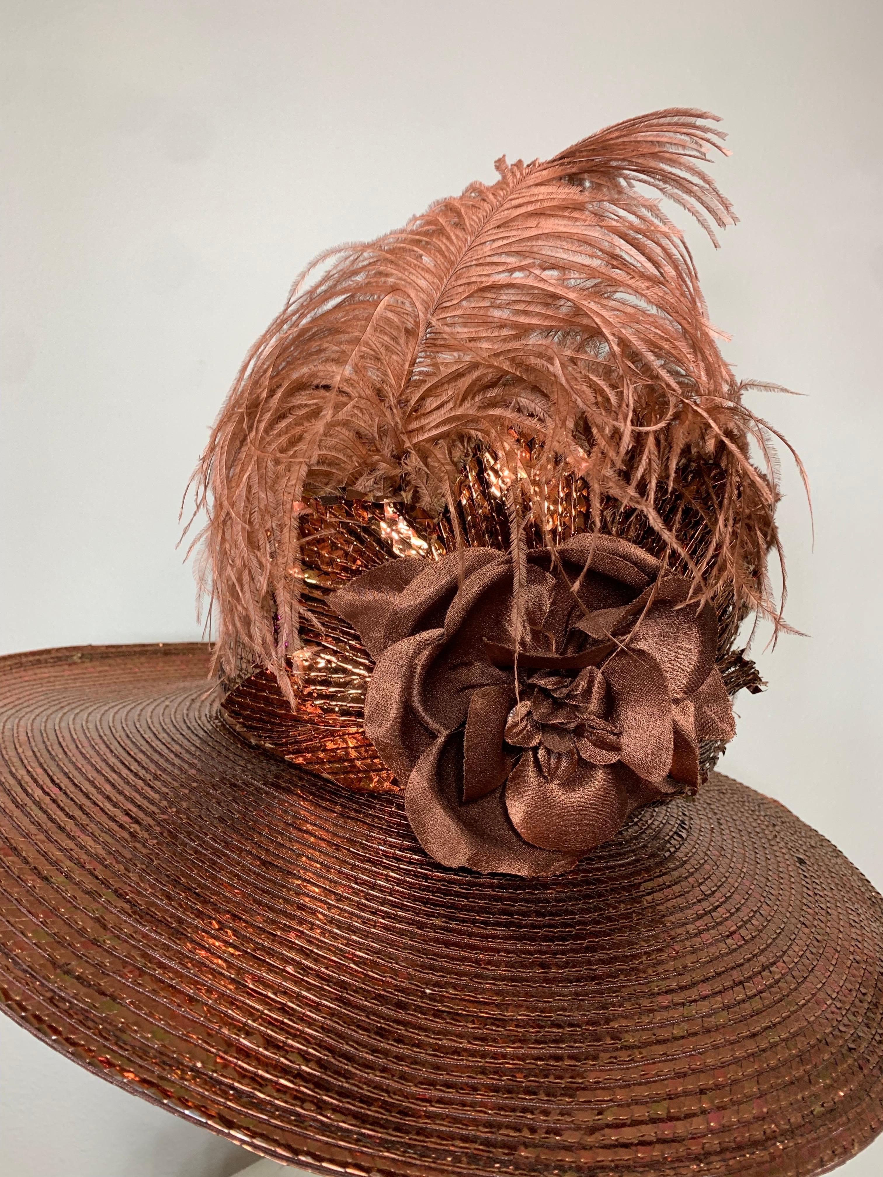 Custom Made Suzanne Couture Millinery Copper Straw Medium Brim Hat w Tall Crown Feathers & Silk Flowers:  Gleaming copper straw hat with slightly convex crown and wide layered hatband in contrasting ribbons. Ostrich feather accent with fabric floral