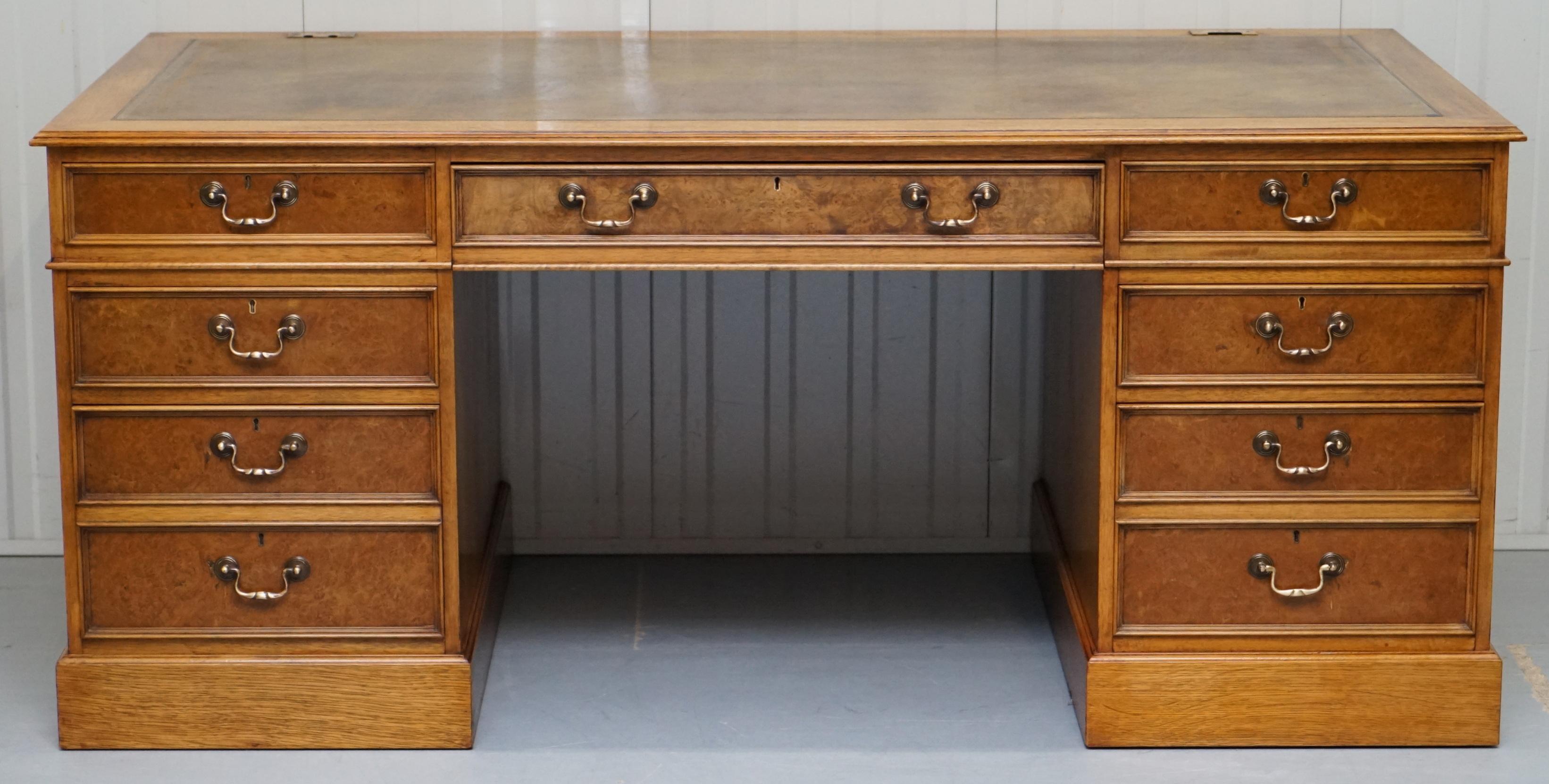 We are delighted to offer for sale this custom made large burr walnut and oak framed twin pedestal partner desk with rare sliding top.

This desk is very rare, the entire desktop sides forward which helps you with leg space, it also has a drop