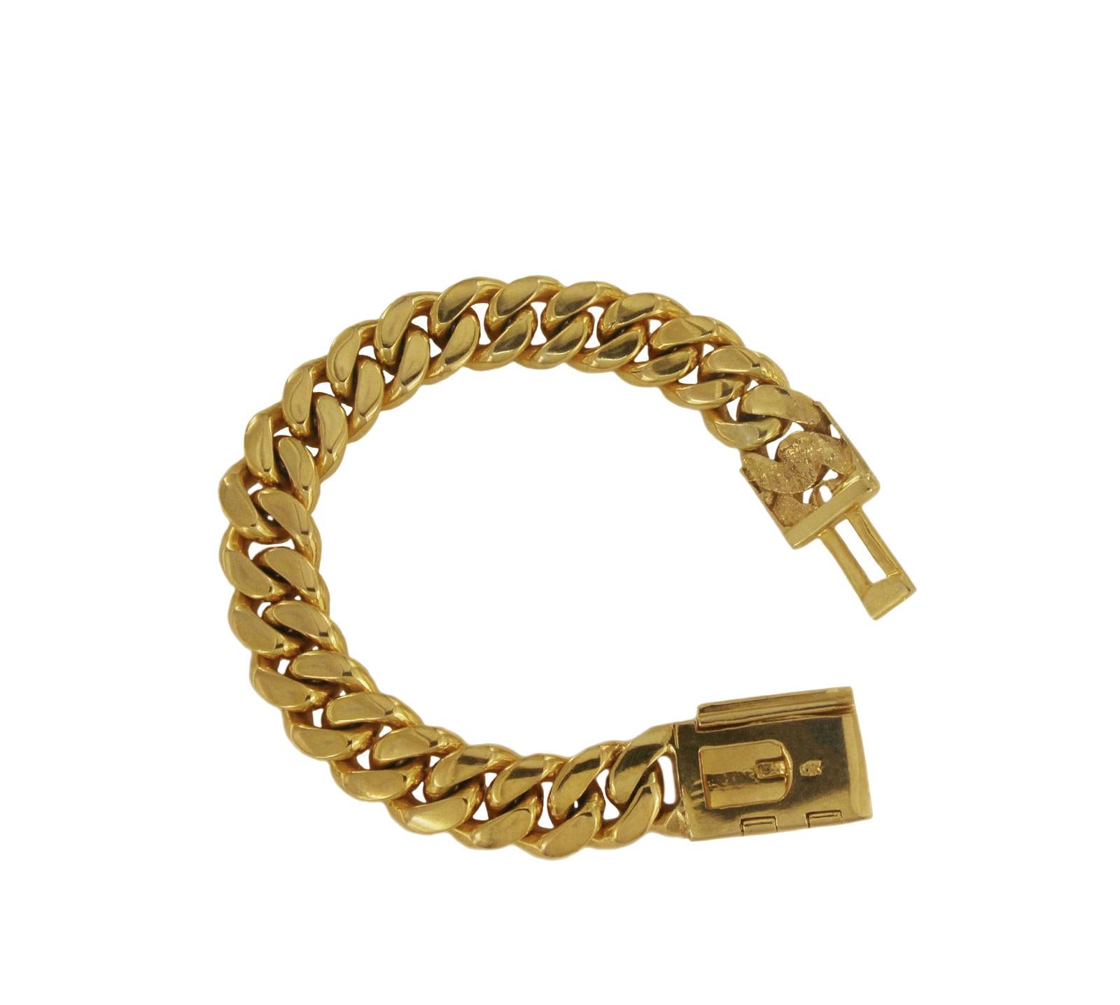 CUSTOM MADE DIAMOND MIAMI CUBAN LINK SOLID BRACELET IN 10K GOLD.

-10k yellow gold
-Length: 8.5”
-Width: 0.55”
-Weight: 114.5 gr
-Diamond: 12.90 ct, VS clarity, G color

Retail: $15,000