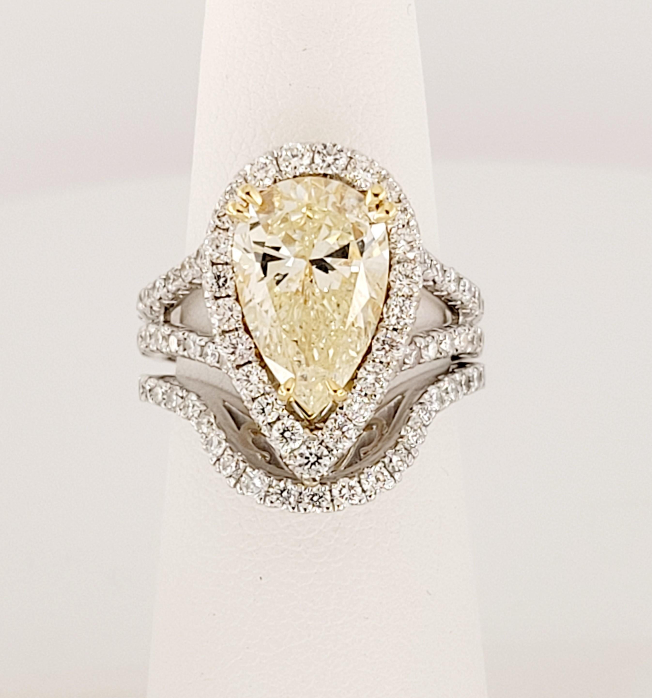 Custom Made Diamond Ring 
Center Stone: 3.37carats
Shape & Cut: Pear Cut
Measurements: 12.85 X 8.34 X 5.16mm
Metal: 18K White Gold 

Polish Good
Symmetry good
Clarity I-1
Color W-X

Side Diamonds: Round Cut Diamonds
Carat: 0.92tcw
Clarity