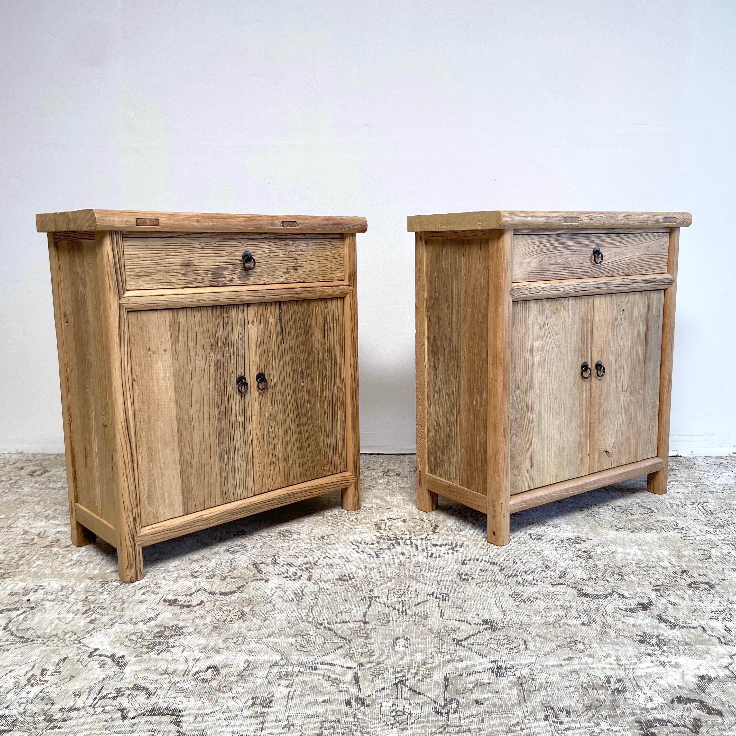 Qty 2 elm cabinets / sold individually
Beautiful patina, elm wood cabinets with drawer and double door storage.
Solid sturdy can be custom made to any size. Please allow 12-16 weeks for a custom order.
Size: 32” W x 16” D x 36” H 
Natural raw
