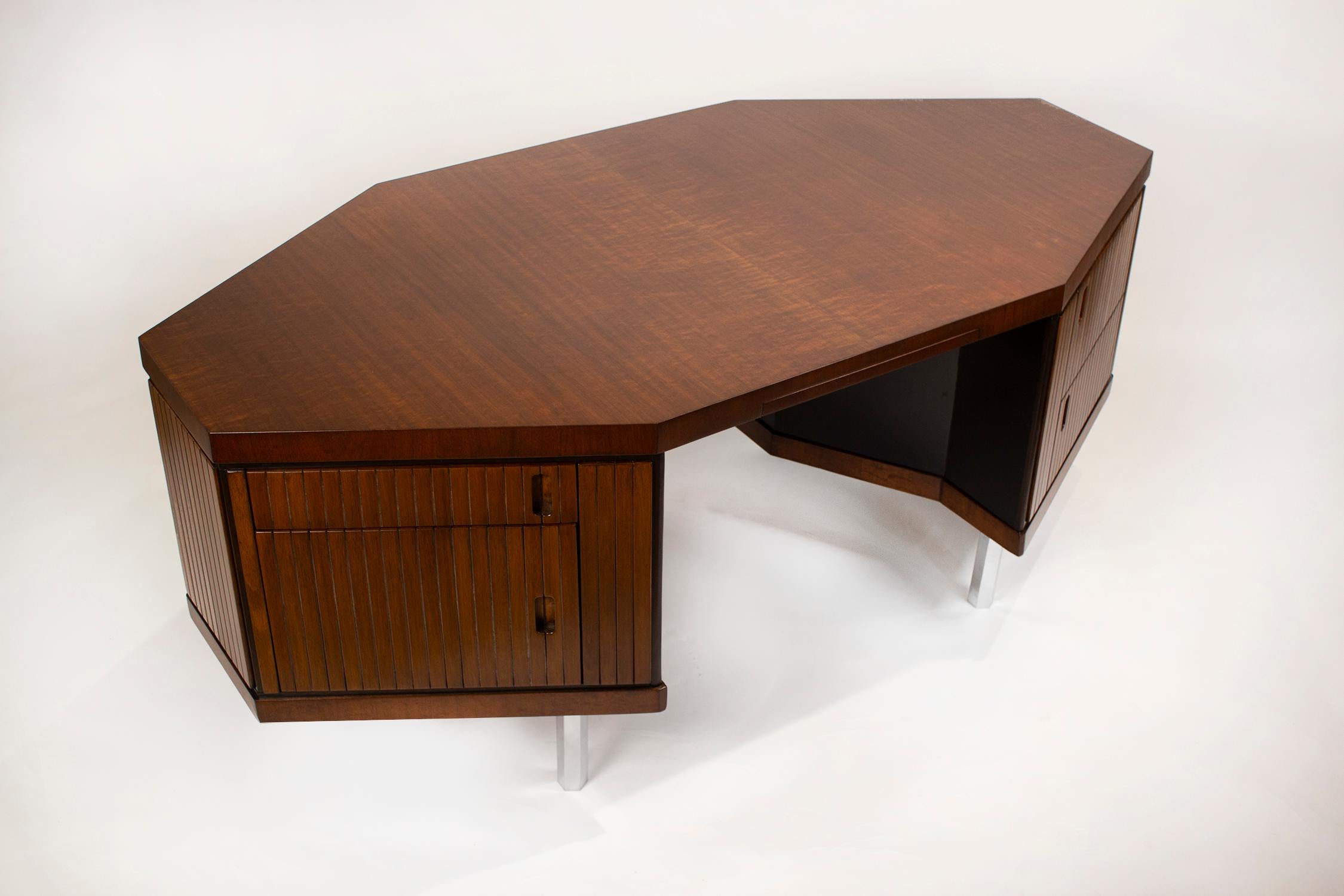 Custom made French ribbon mahogany and solid oak hexagonal Pierre Paulin desk. This desk was selected by Simon Doonan from a Parisian dealer as one of the key pieces used as a floor display in the women's couture department of the Barney's New York