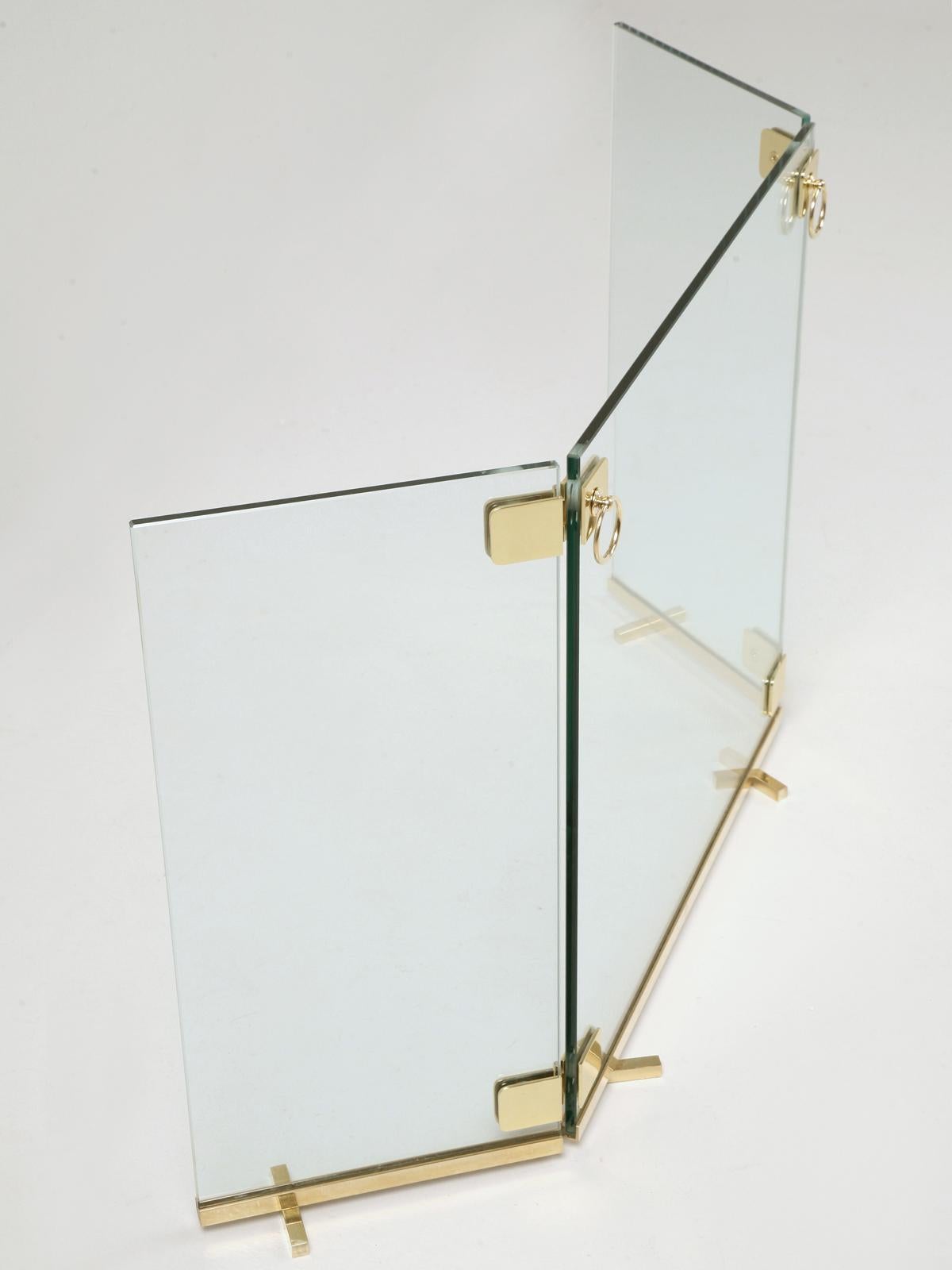 Custom fabricated Mid-Century Modern Fire Screen made to your specifications. Constructed of clear tempered glass and accented with solid brass trim, this beautiful Mid-Century Modern Fire Screen will easily last a lifetime. A free-standing 3 panel