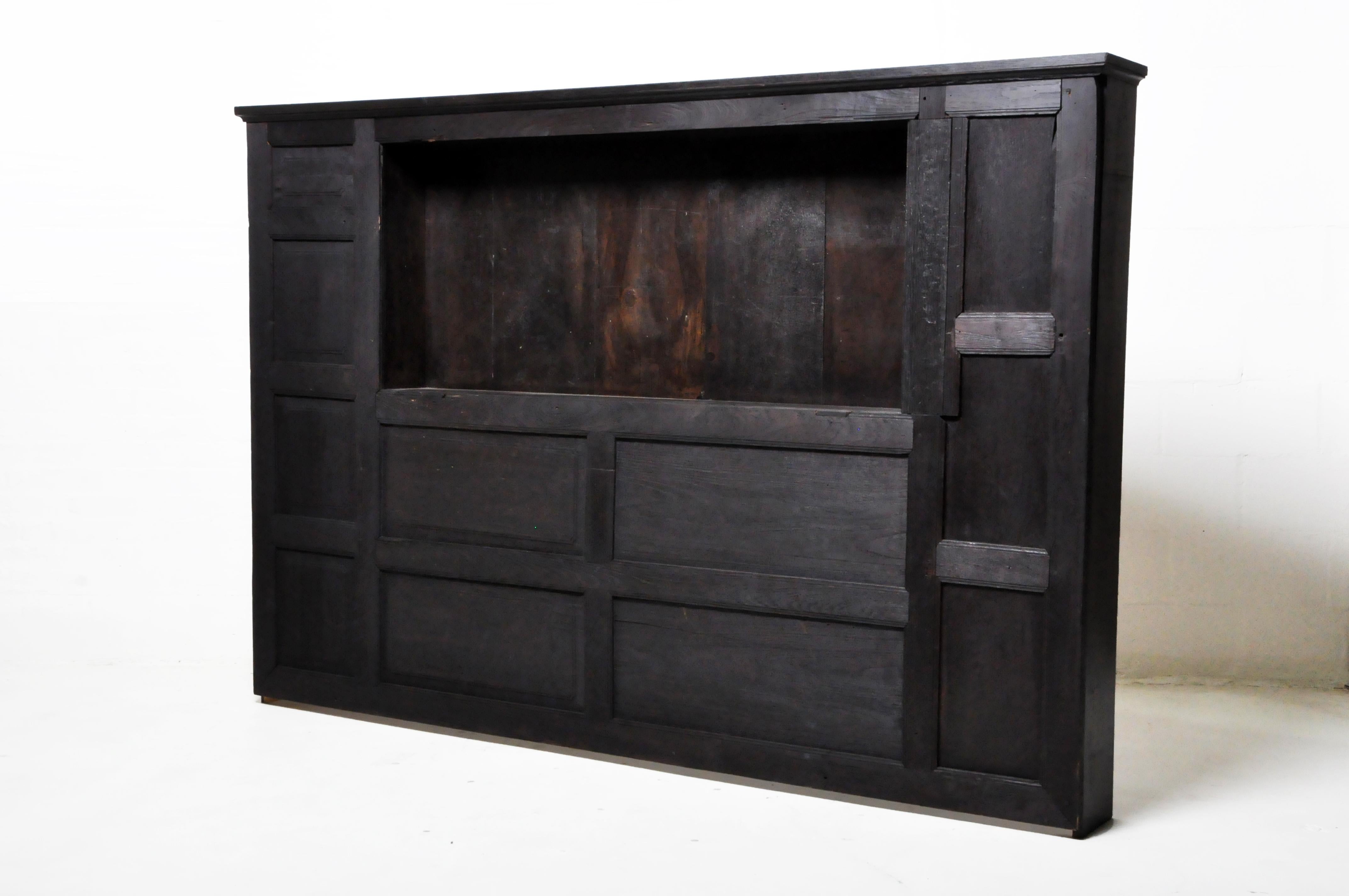 This custom-made headboard was made in Chicago, IL from reclaimed wood and stain, c. 21st Century. 
 