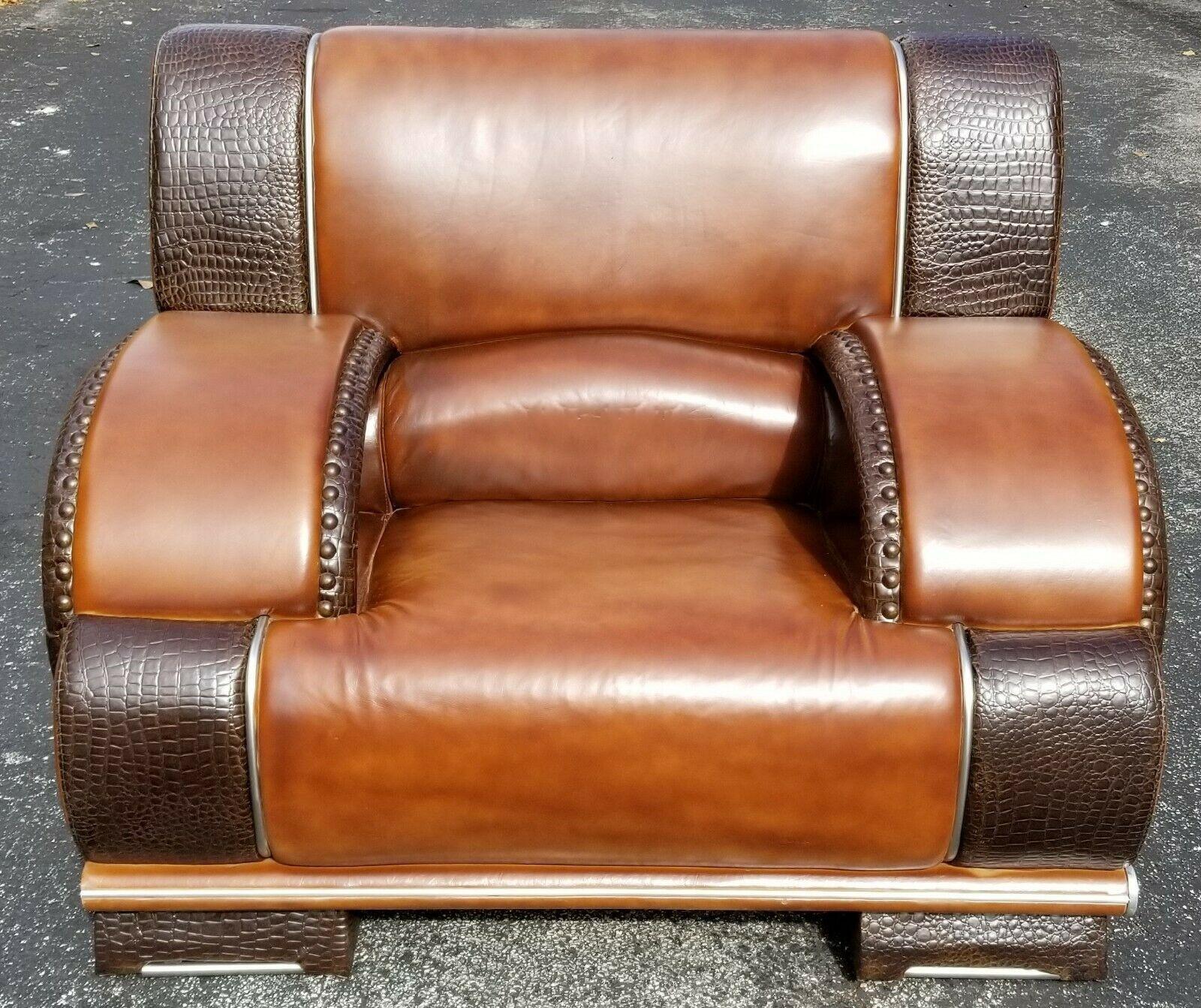 Offering one of our recent Palm Beach estate fine furniture acquisitions of a
exceptional and very comfortable, vintage custom made real leather and crocodile skin lounge chair
Featuring real Crocodile studded with brass nail trim, and chrome piping