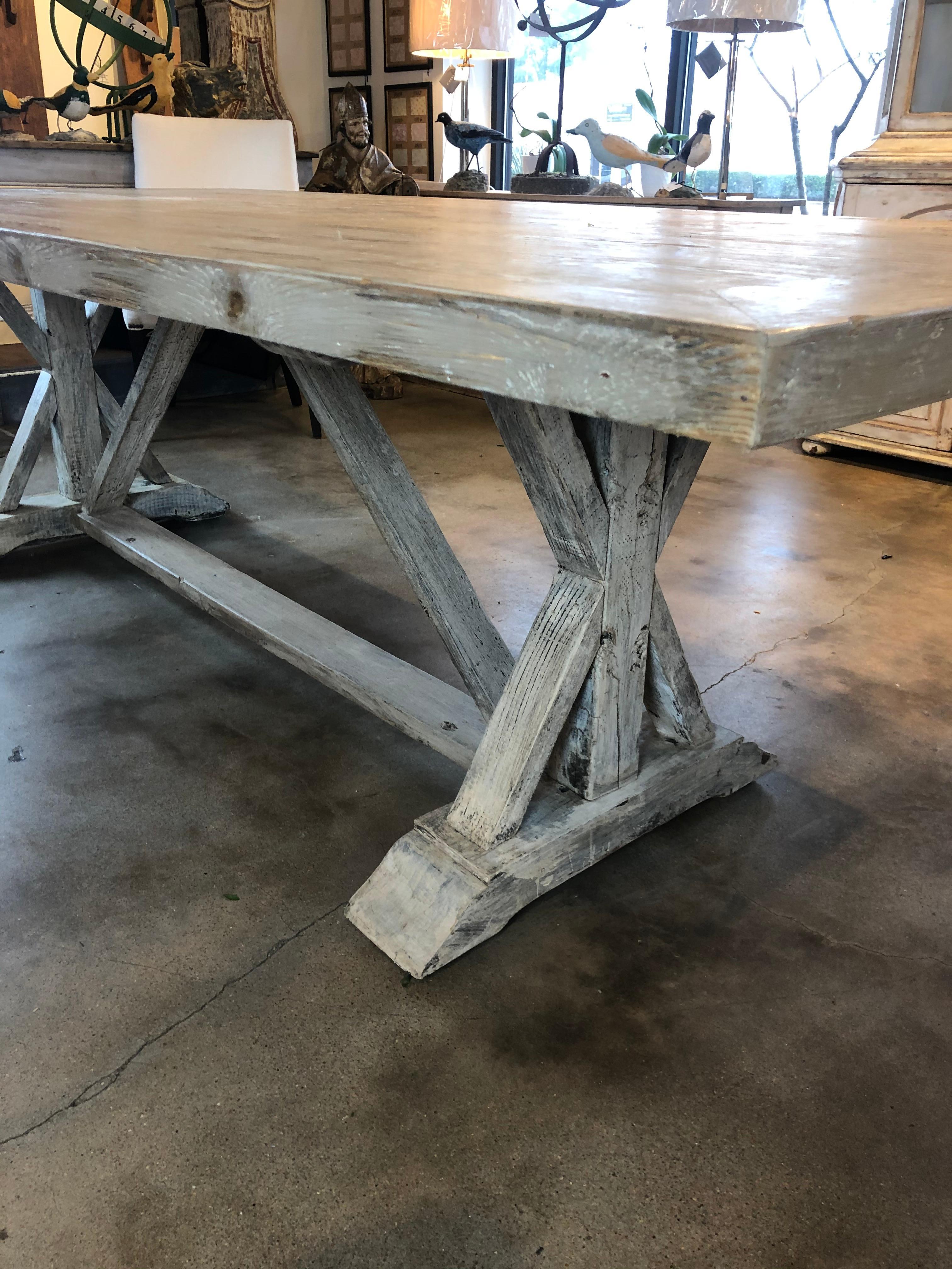 This Italian Trestle table can comfortably seat 8 people or bring in a bench and seat more in a casual setting. It hits all the style marks with its whitewashed patina. The top is a substantial size and could accommodate 2 people on the ends as