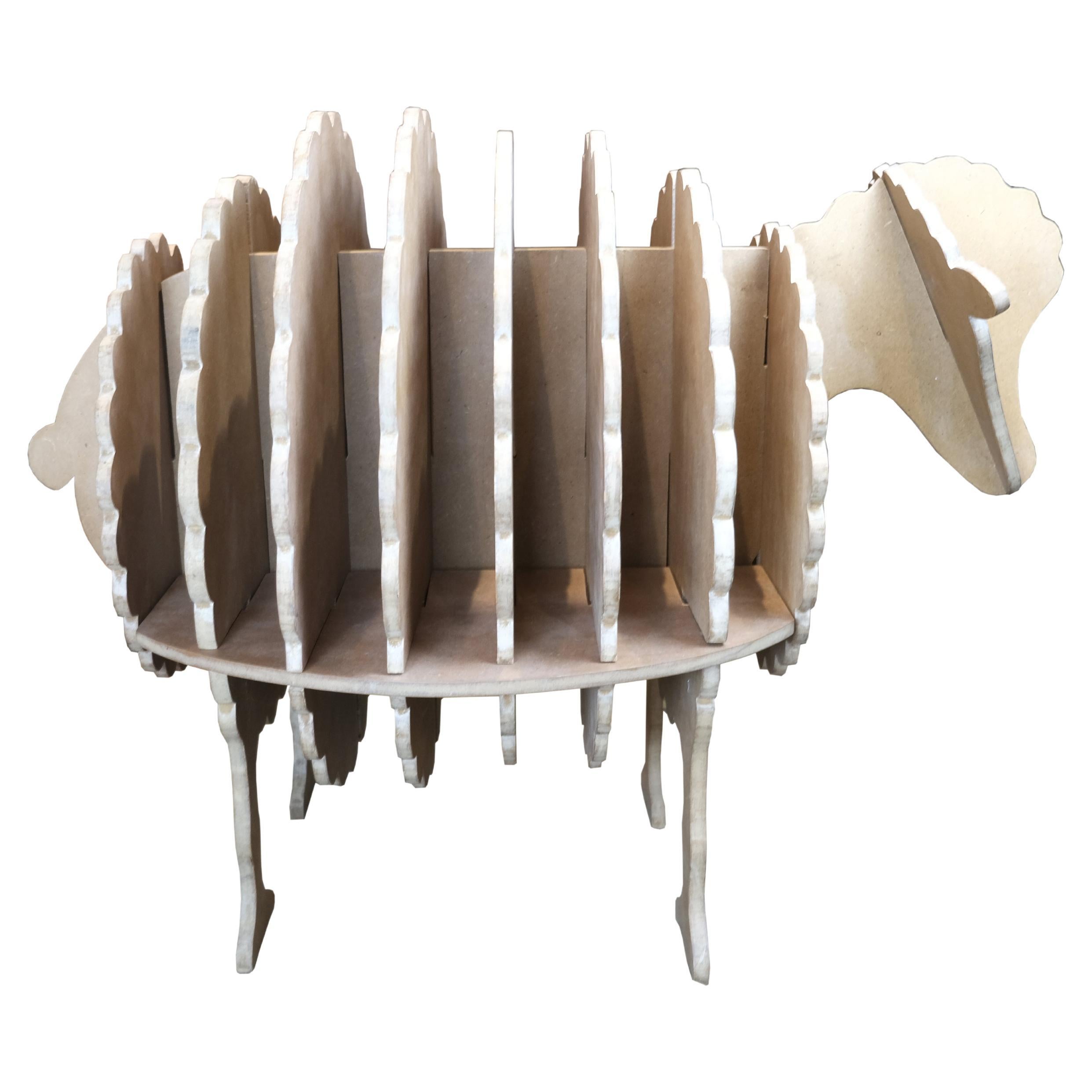 An Italian artisan's fanciful interpretation of a sheep, crafted with interlocking wooden segments that magically capture its woolly essence. An eye-catching accent piece that will liven up any room in the house. Assembling it is also amusing, and