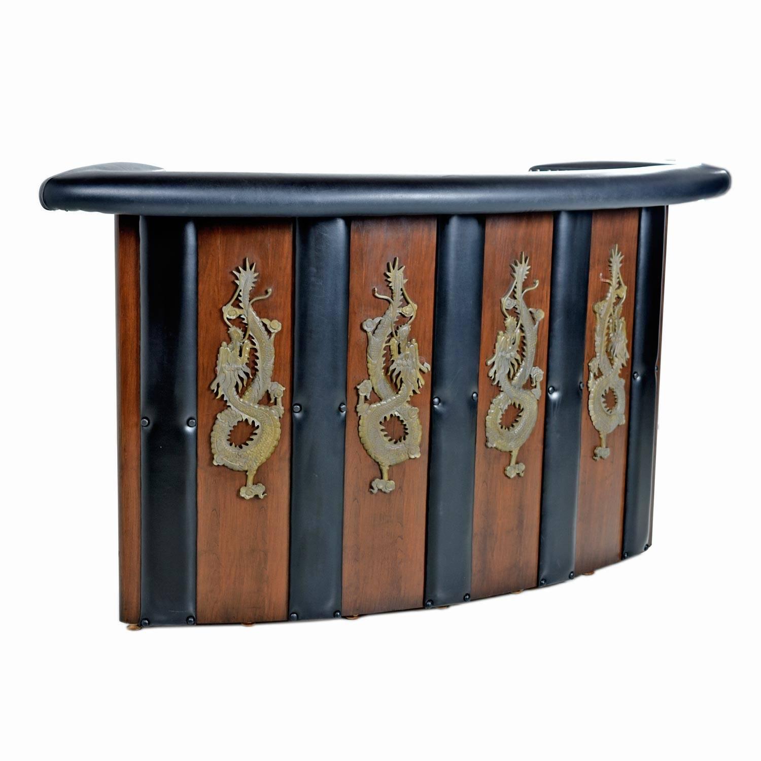 This Asian modern bar is the stuff dreams are made of if you love dragons as much as we do. The tufted vinyl panels on the wood backdrop add a sleek and sophisticated finish while fashionably framing each dragon. The dragons are wood carved though