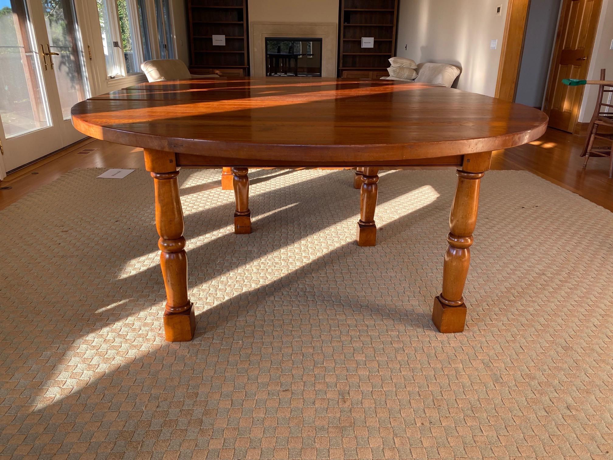 Custom-made Large Pine Round to oval dining table, Handmade in England
Six turned baluster legs ending on square blocks. 
72” round (not perfect round)
2 x 18” leaves
Measures: 108