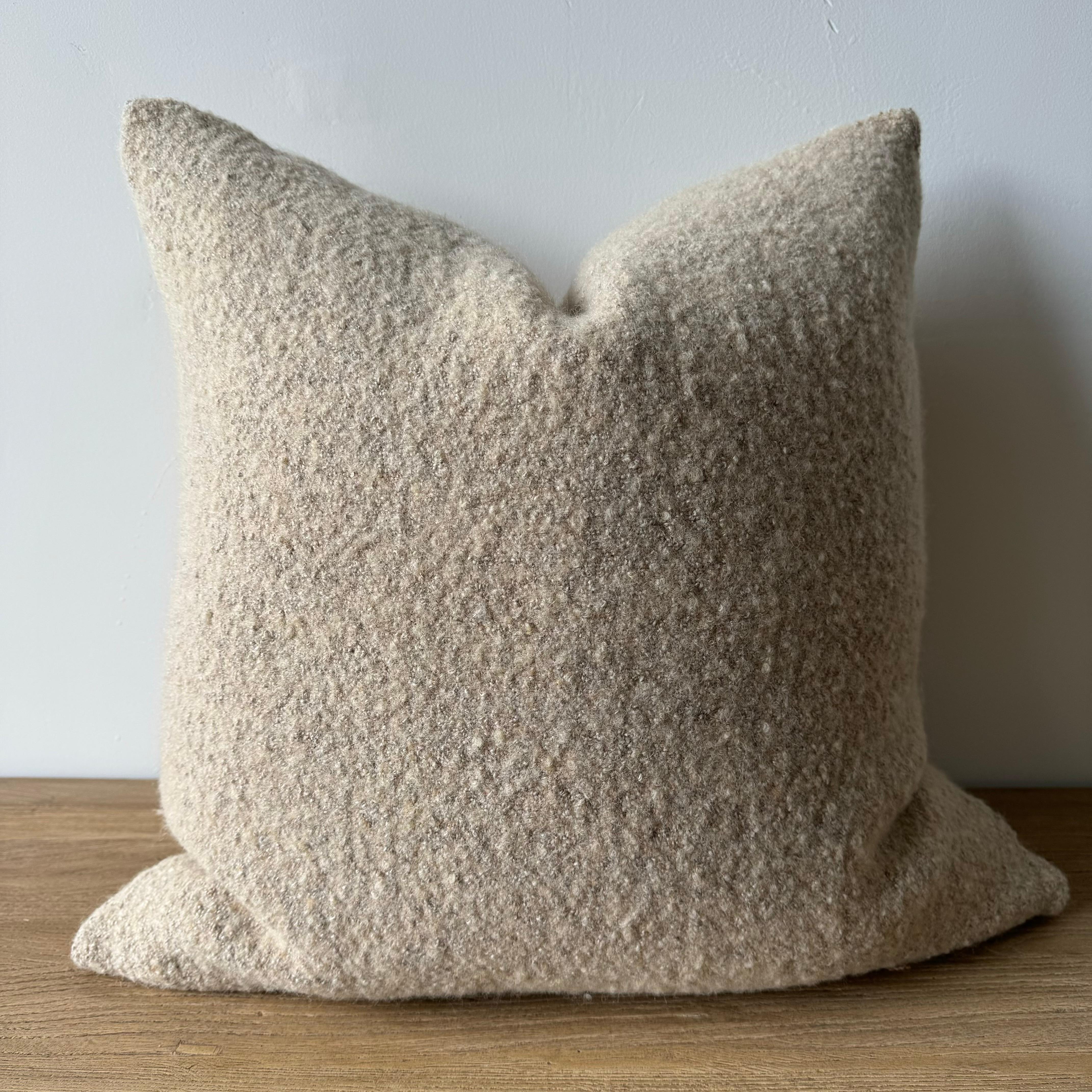 A soft oatmeal flax color, with hints of pale nude tones and natural flax oatmeal woven fibers in a stonewash finish create this luxurious soft pillow. Sewn with an antique brass zipper closure and overlocked edges.
Includes a down/ feather