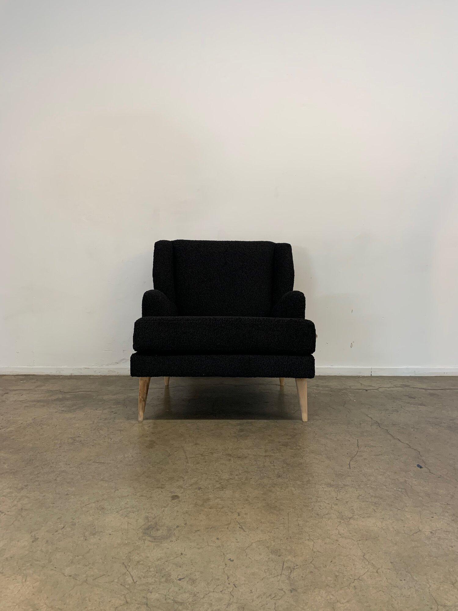 W31 D37 H33

SW21 SD22.5 SH17.5 AH7.5

Custom made, entirely in house all in black Sherpa with solid birch legs. The seat is wide with a reclined position. This piece is based on a vintage design by Paul McCobb 