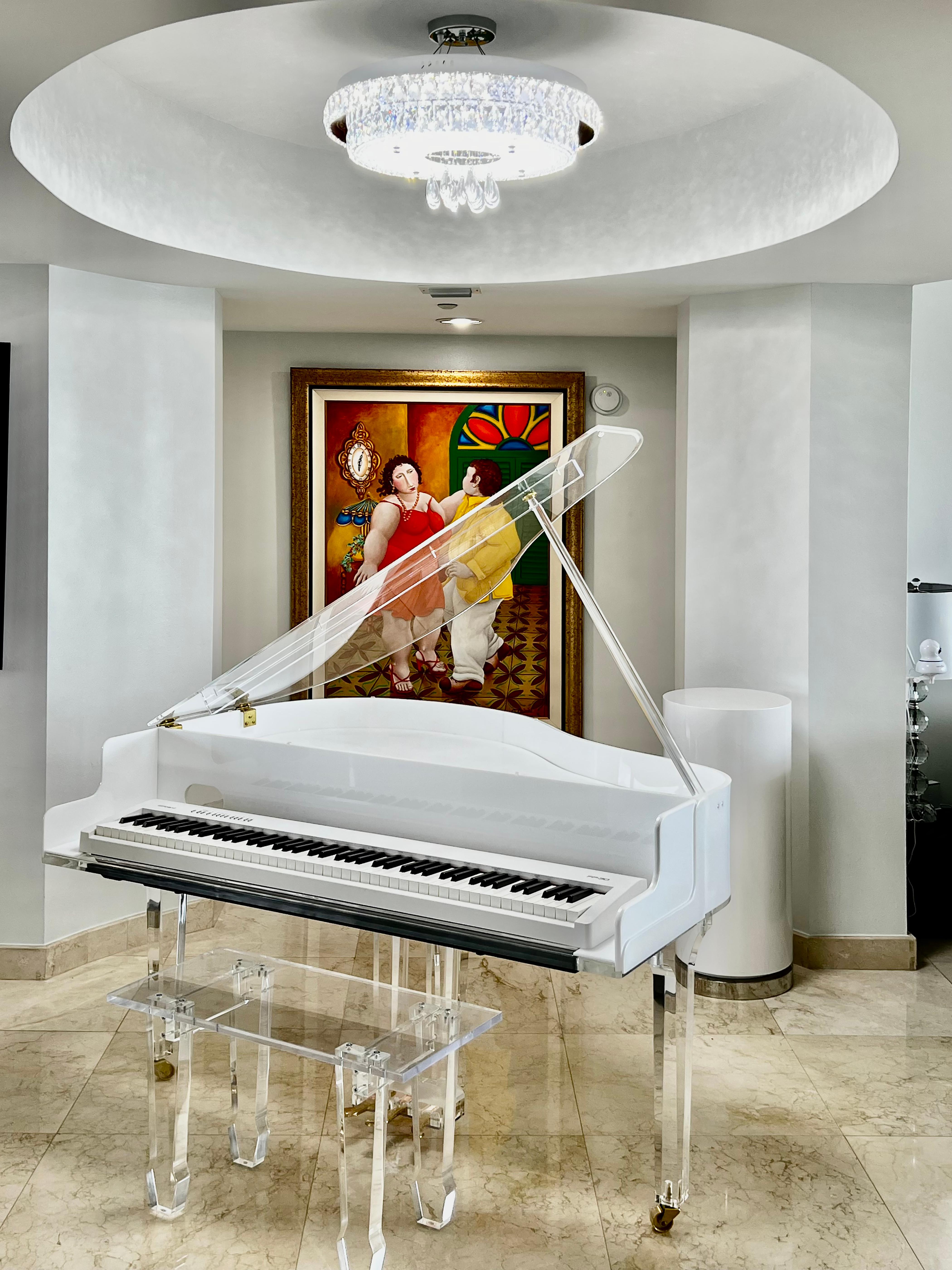 Custom-made Lucite Acrylic Baby Grand Piano and Bench by Iconic Design Gallery

Offered for sale is a new custom-made baby grand piano in Lucite and acrylic with a matching bench. The piano is crafted with thick Lucite legs on casters and a hinged