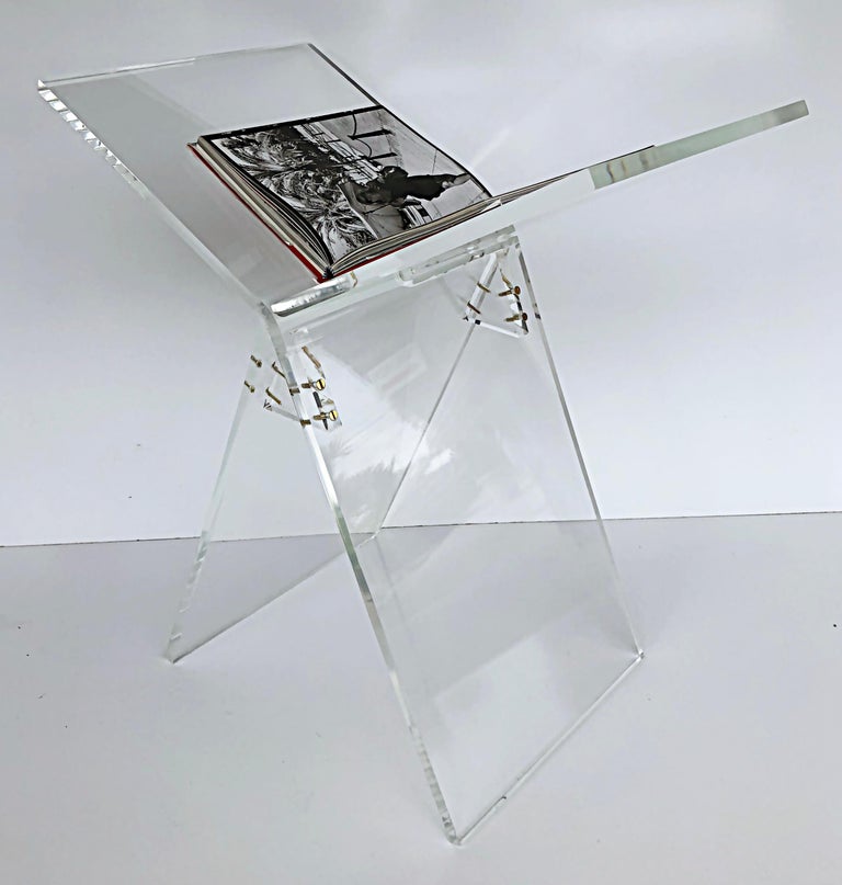 Custom Made Lucite Oversized coffee table book stand for Taschen Sumos

This large, free-standing lucite book stand allows you to display and view oversized specialty books as seen at booksellers, Taschen and Assouline. The stand is finished with