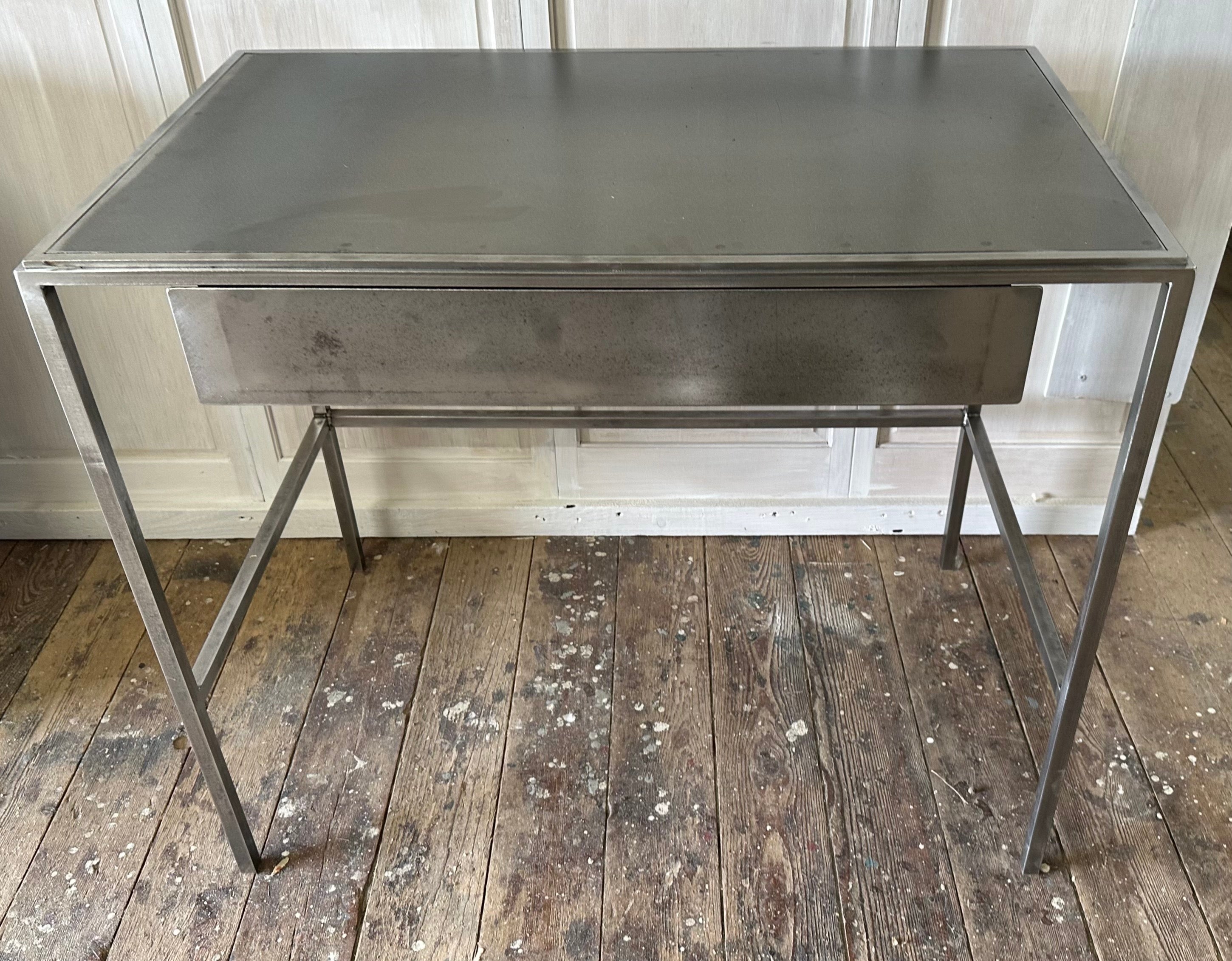 Custom made and designed by us. this versatile modern and traditional styled piece can be used as end table, vanity, desk or dressing table. Table has distressed metal top insert and a drawer. Matching vanity stool available. Can work well in