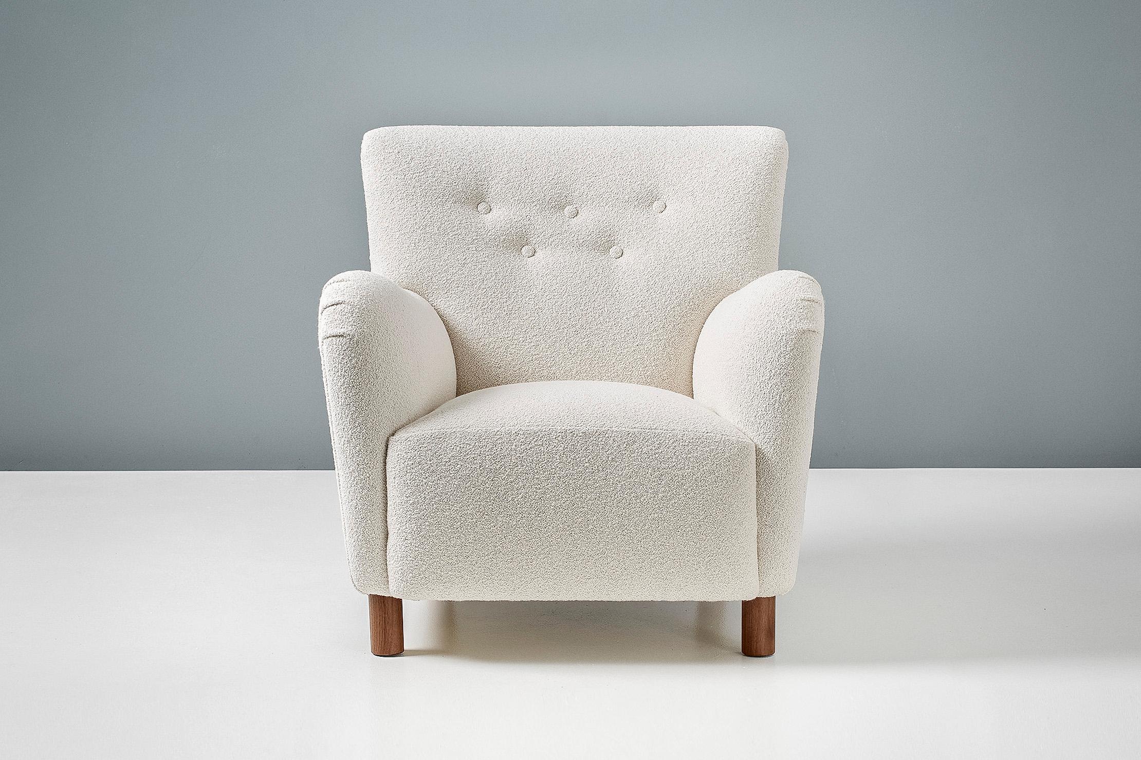 Dagmar design Model 54 lounge chair

A pair of custom made lounge chairs developed and produced at our workshops in London using the highest quality materials. These examples are upholstered in luxurious cotton-wool blend off-white bouclé fabric and
