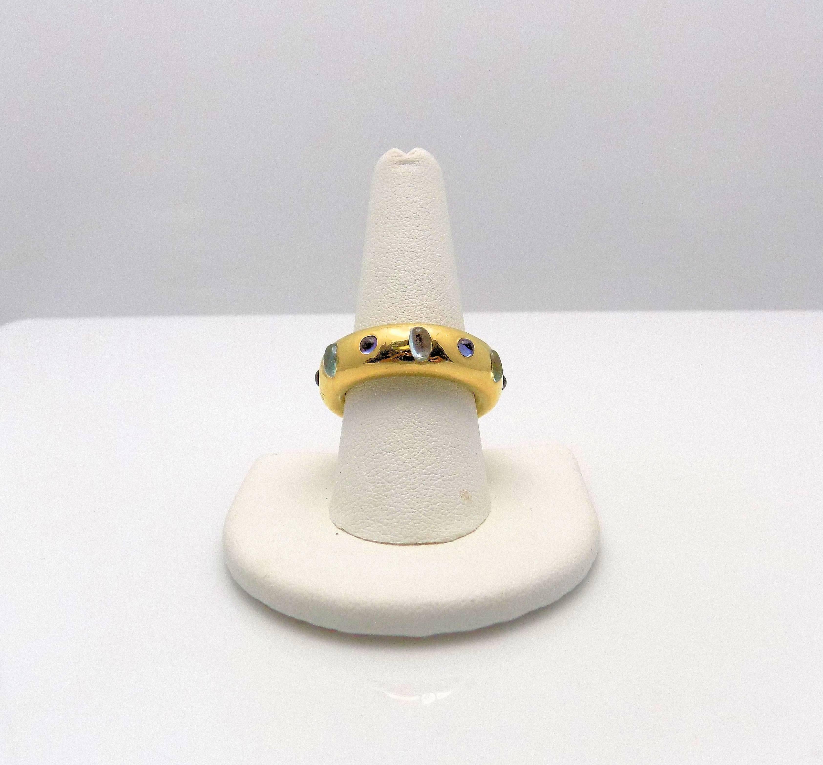 Stunning 18 Karat Yellow Gold Custom Made Ring with 6 Oval Aquamarines 5 X 3 MM; 6 Round Cabochon Tanzanites 3 MM.  Signed:  NM for Neiman Marcus.  Ring Size/Finger Size 9 (Never Worn) 12.7  DWT or 19.75 Grams.