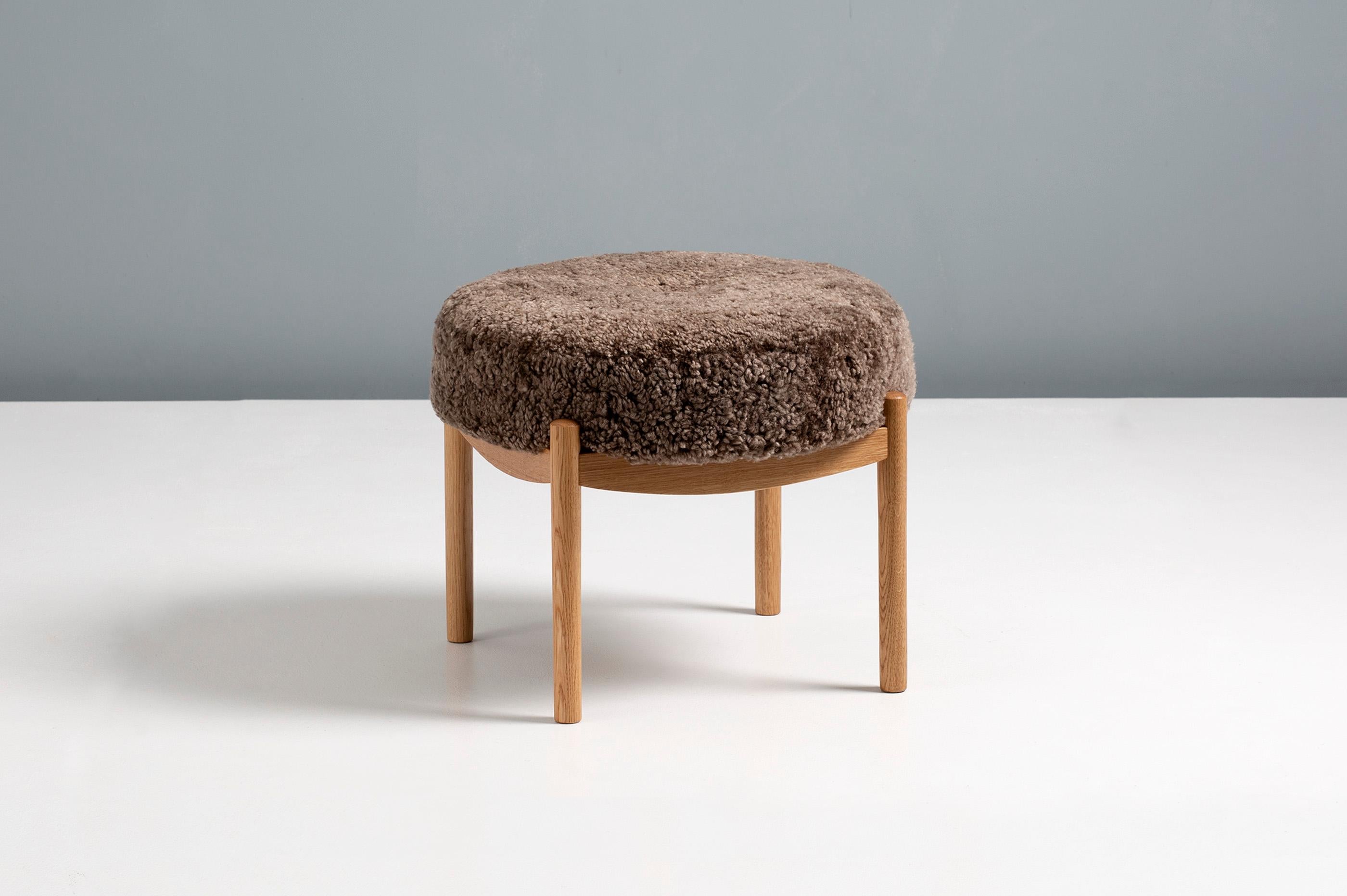 Dagmar Design

Blek Ottoman

A custom-made round ottoman with solid wood frame developed & produced at our workshops in London. This examples have frames in oiled European oak and a seat upholstered in Sahara brown sheepskin. THe Blek stool is