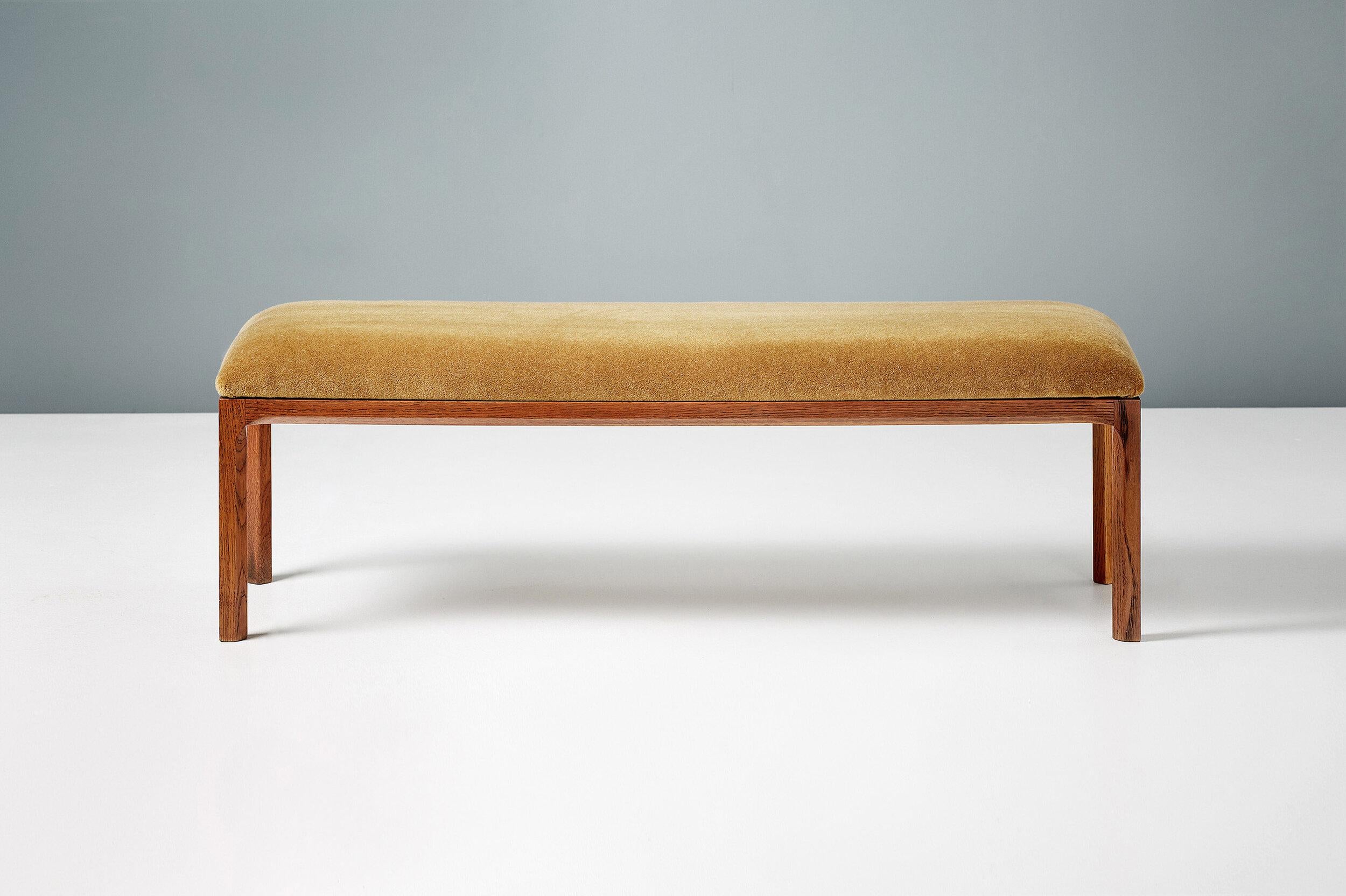 A custom-made upholstered bench with fumed and oiled oak frame. The padded top has been upholstered with in Pierre Frey mustard mohair velvet. 

*Alternative upholstery options also available by request. 

Measures: Length 118cm
Height