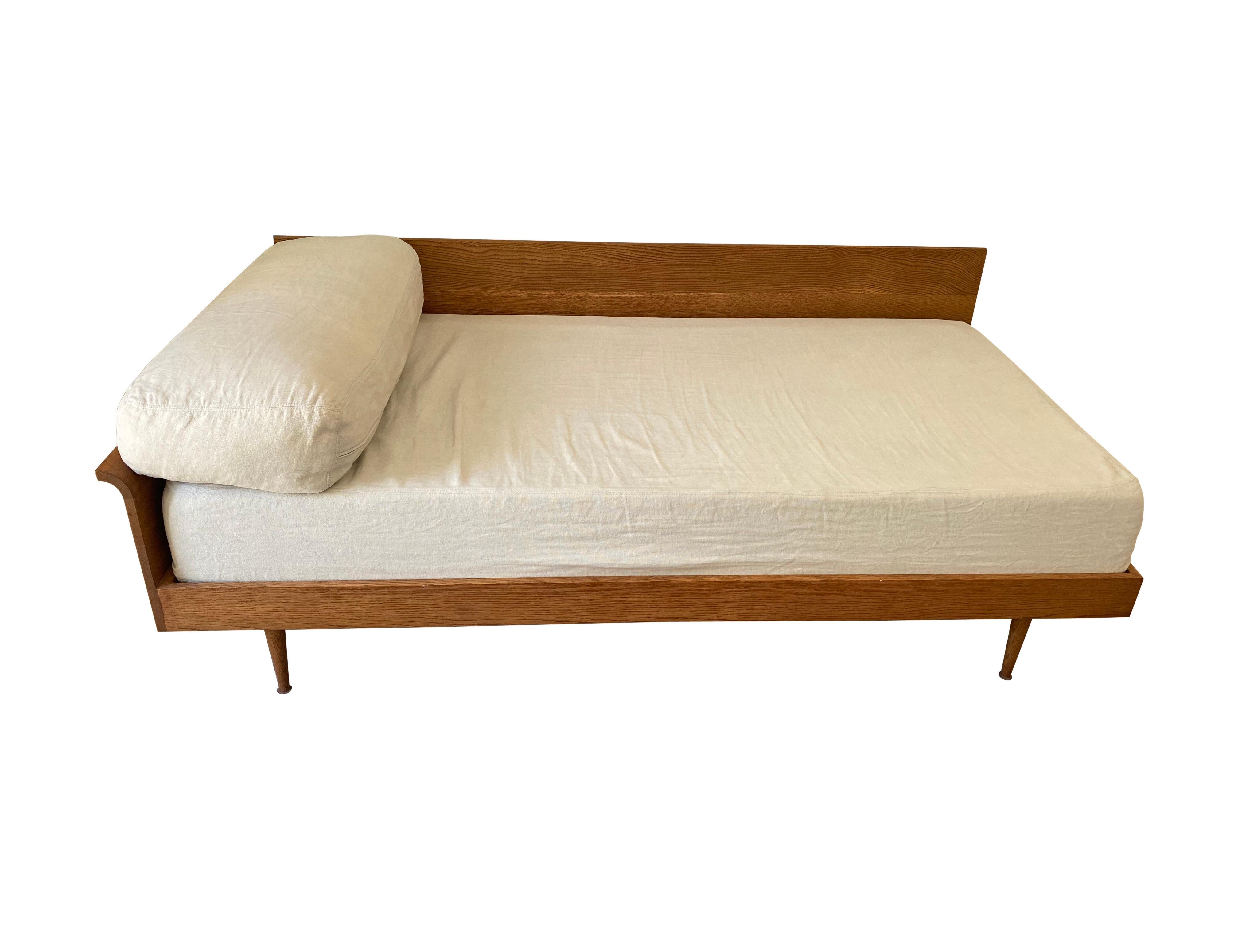 Beautiful custom hand made, Oak daybed with full XL cushion and two header pillows. Inspired by Swedish mid century modern designs. Ideal addition for a living room, guest bedroom or dressing room. Clean and simple design so perfect for minimalist