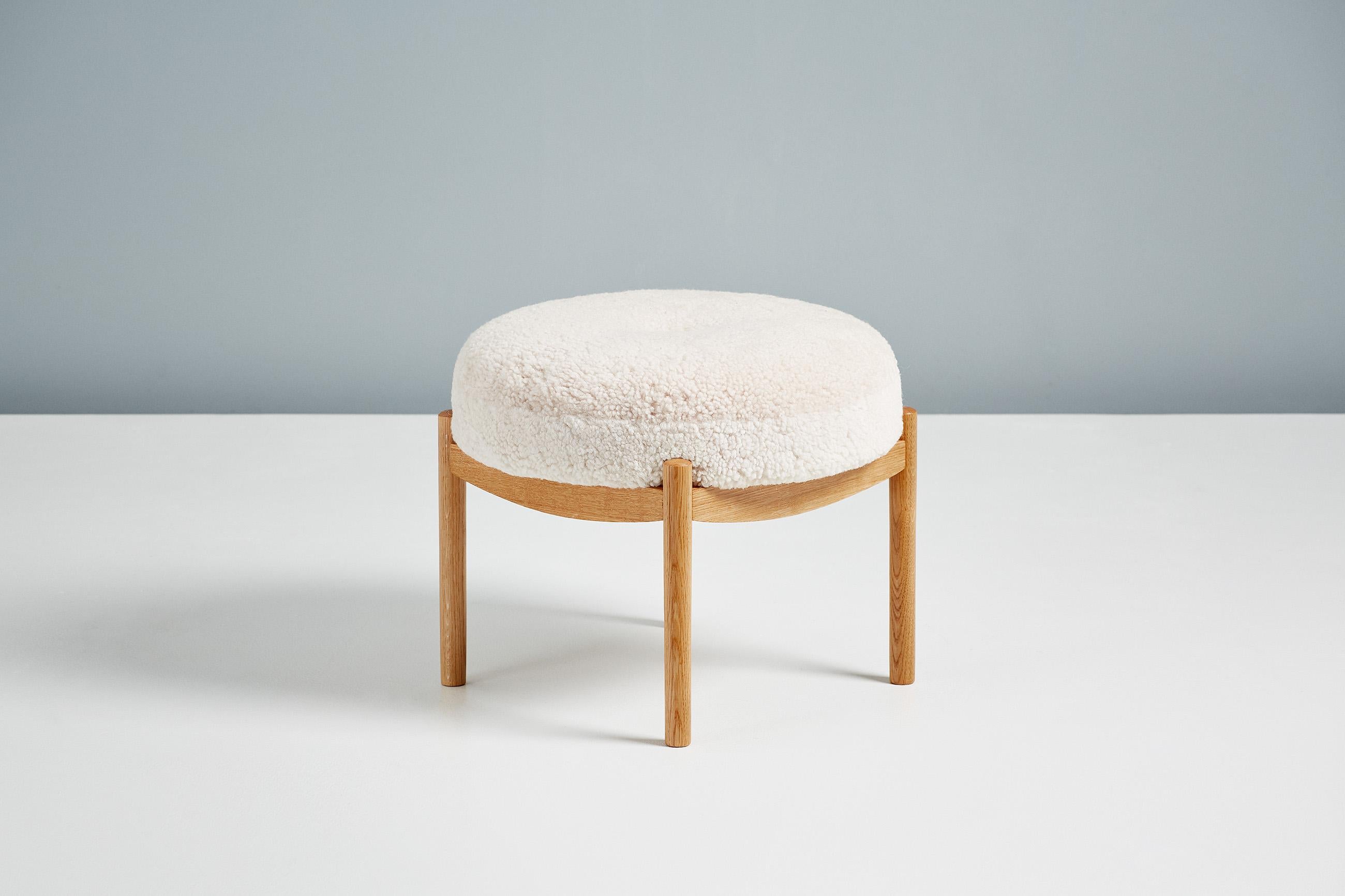Dagmar Design

Blek Ottoman

A custom-made round ottoman with solid wood frame developed & produced at our workshops in London. These examples have frames in oiled oak with seats upholstered in Moonlight sheepskin. Blek is available to order in