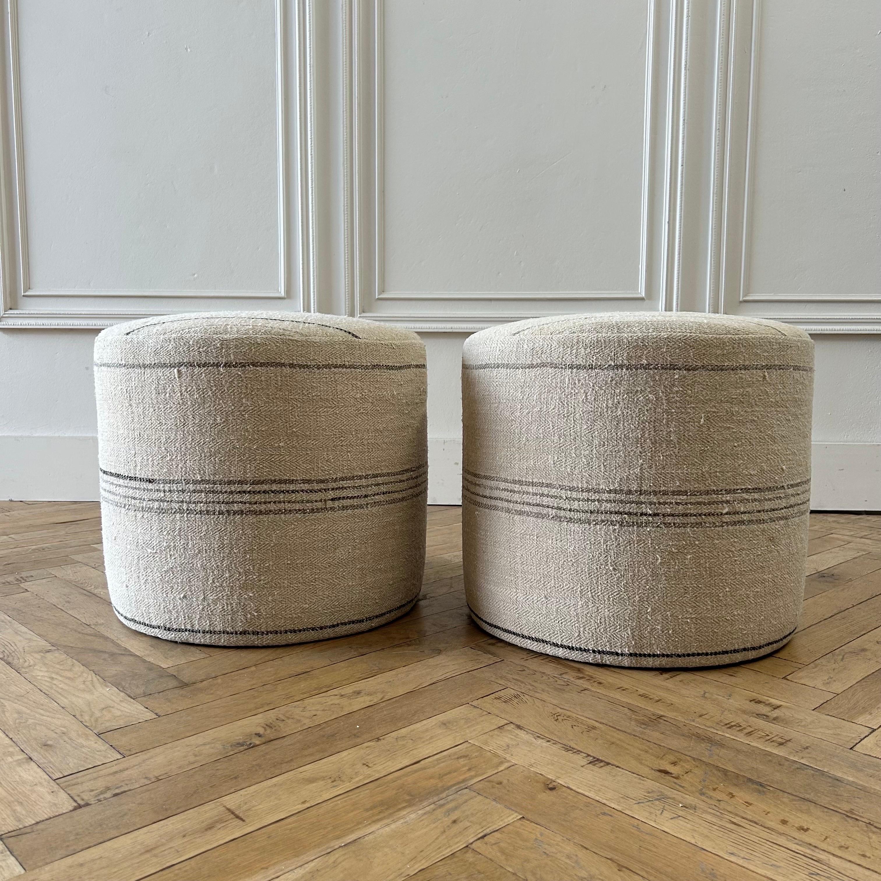 Sold only as a set.
Pair Rd. Cube ottoman 21”rd. X 18”h
Custom made from vintage european flax with stripes.
Color: Natural / Flax, with stripes in gray and coal.
Sits medium to firm, can be used everyday. This will not lose shape as the frame