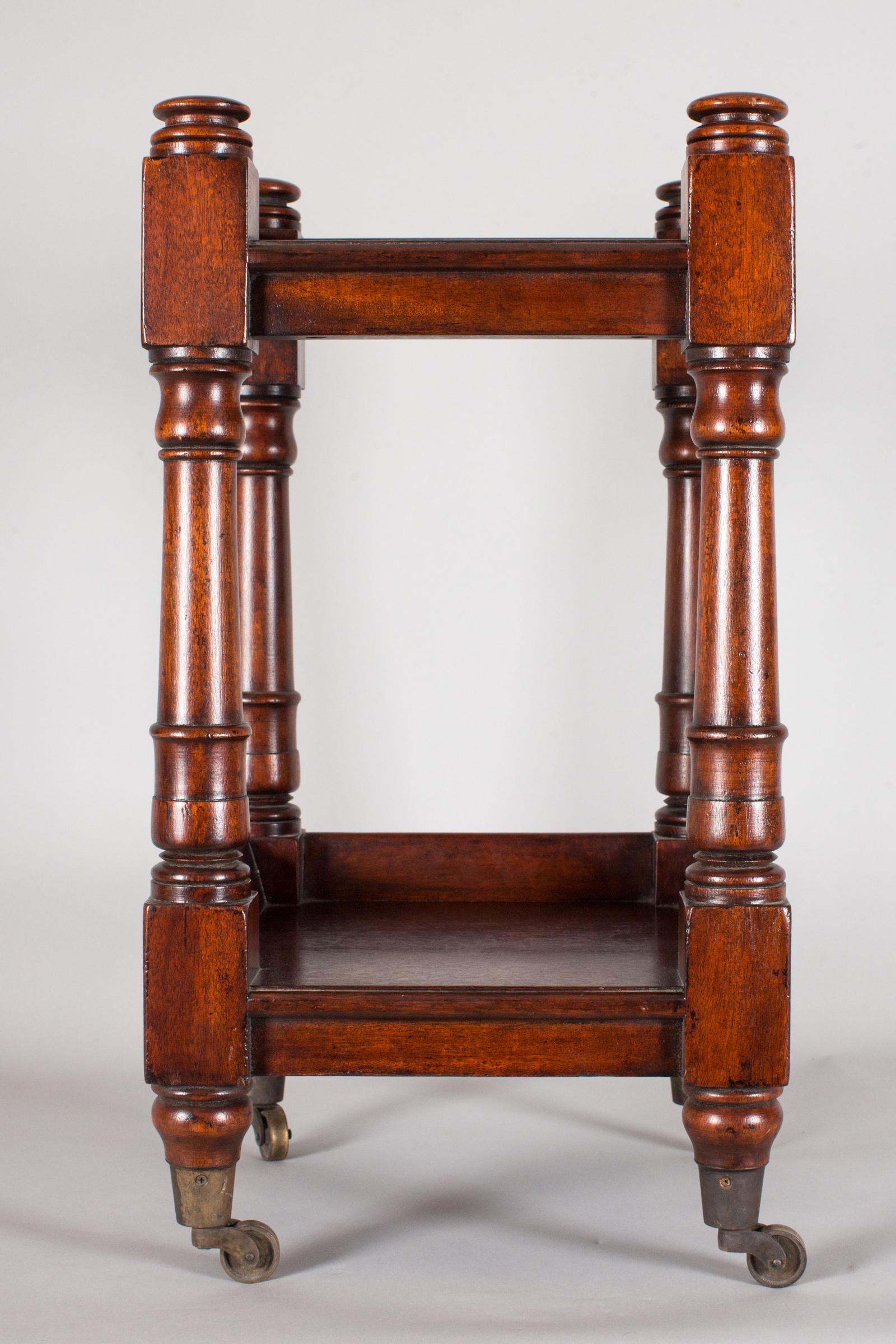 Charming mahogany side table with two levels and on castors (wheels can be removed).