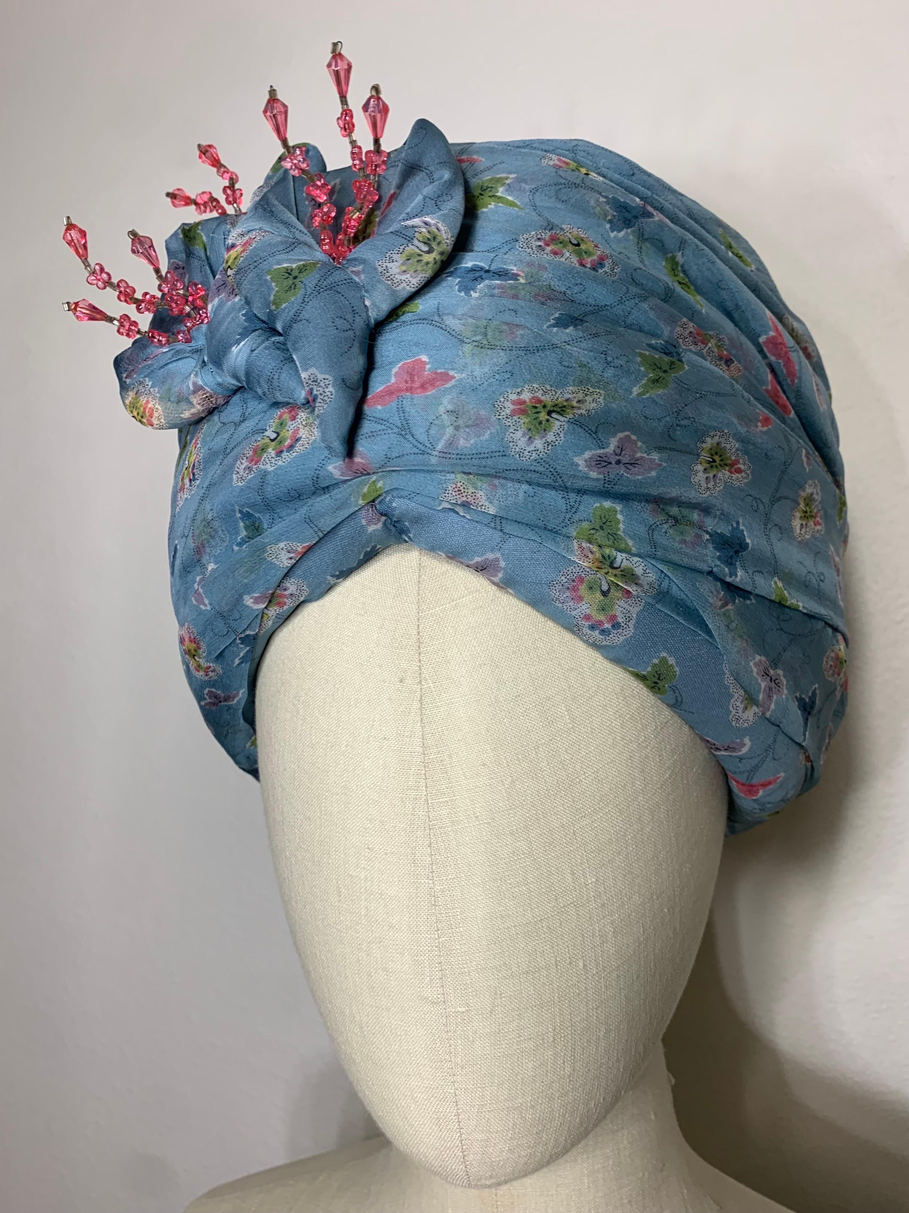 Custom Made Periwinkle Blue Floral Print Turban w  Fabric Lilies and Crystal Center Stamen Embellishment: Created by Suzanne Couture Millinery with a lovely print silk chiffon fabric draped over a stiffened buckram base. Matching hat pin included.
