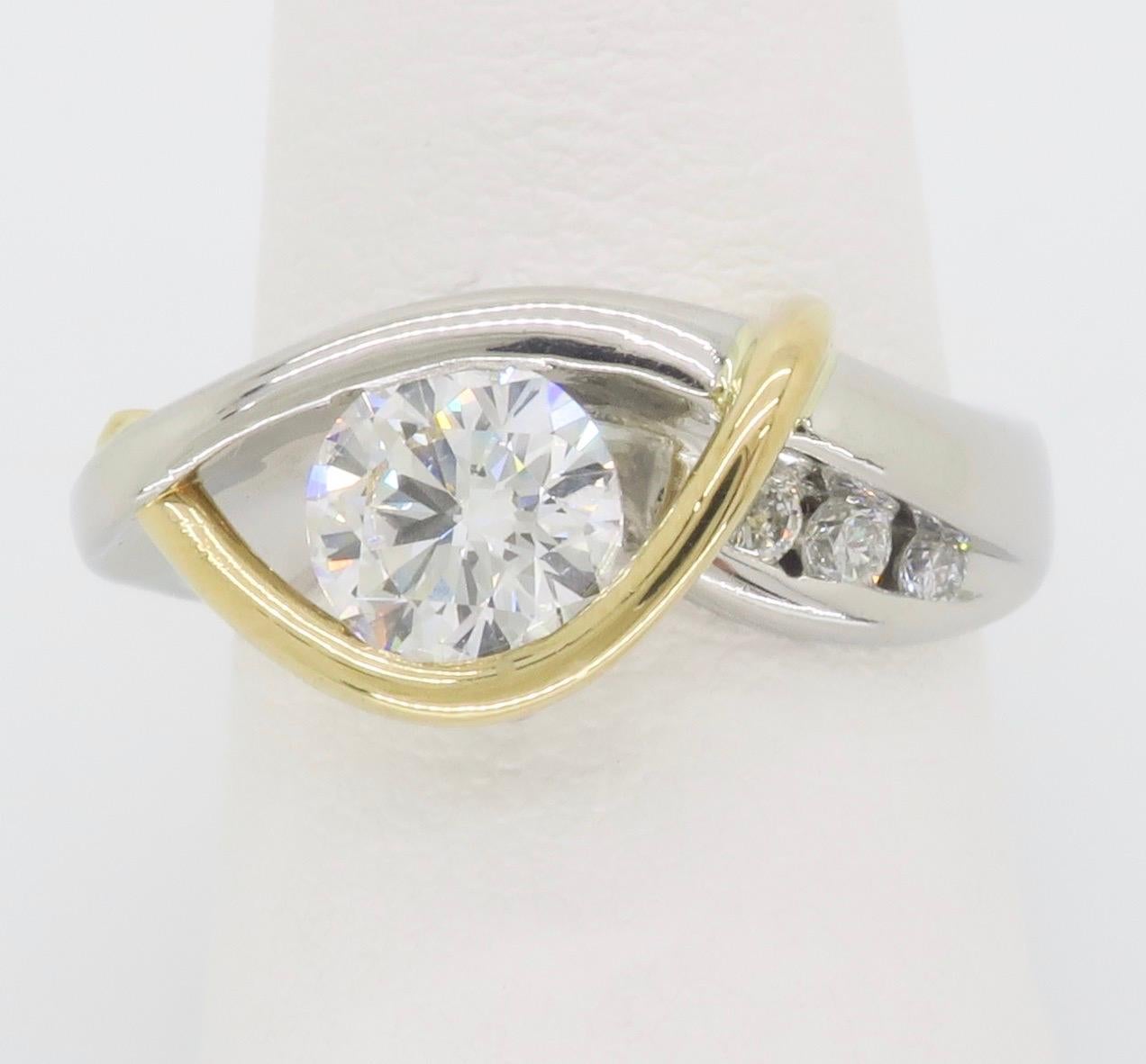 Custom made Platinum & 18k yellow gold contemporary ring, featuring a GIA certified diamond that can be worn two ways.  

Center Diamond Carat Weight: 1.00CT
Center Diamond Cut: Round Brilliant
Center Diamond Color: F
Center Diamond Clarity: