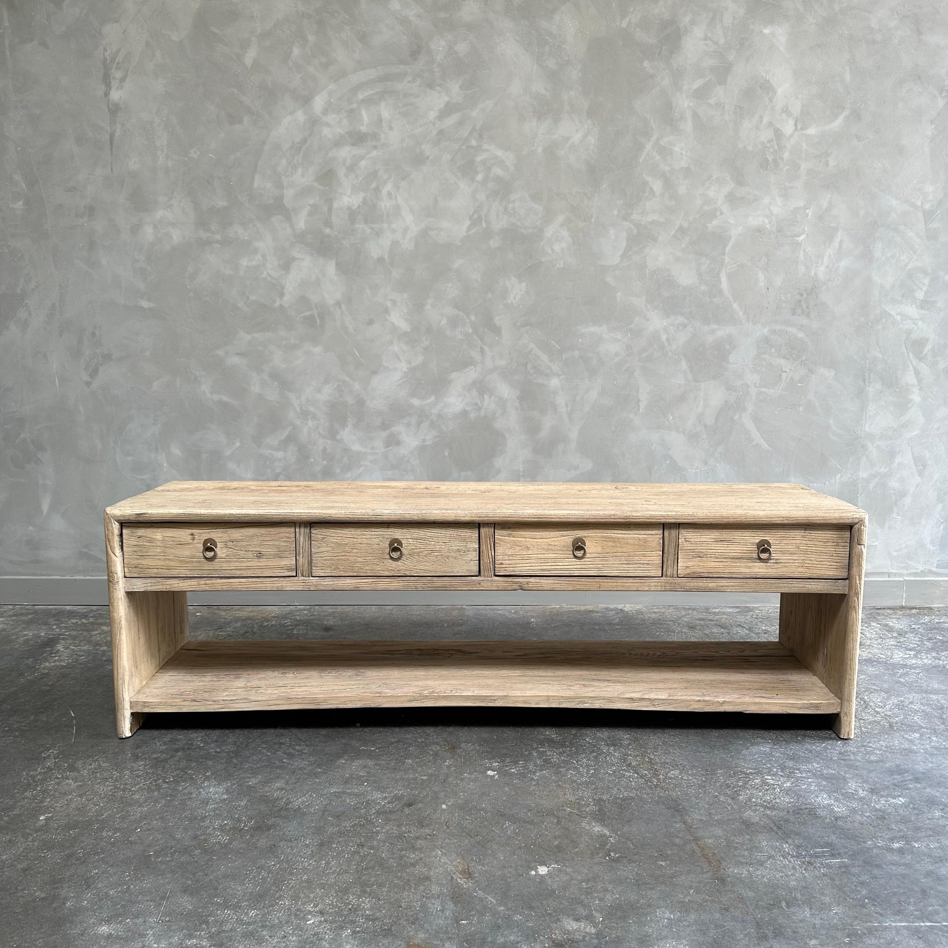 Custom made low console by bloom home inc. 
These old elm timbers show in its most primal, natural form. The artisanal construction methods highlight the elm woods beautiful grain pattern & knots and fissures from its past life. The most authentic
