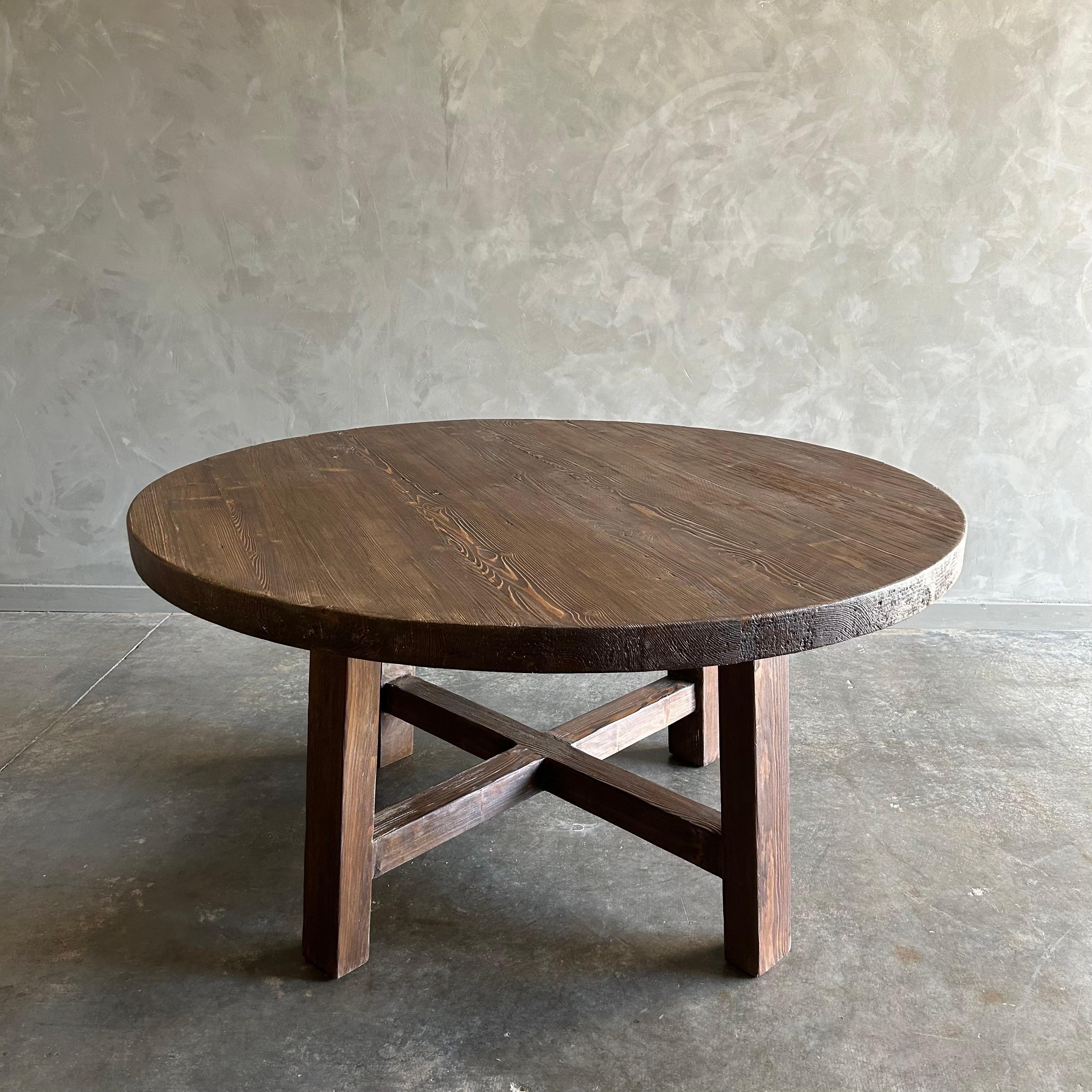 Introducing the Hana Reclaimed Dining Table in Walnut, meticulously crafted from reclaimed elm wood with a solid wood construction. This elegant piece features a rich walnut stain finish, enhancing the natural beauty of the wood. With a 60