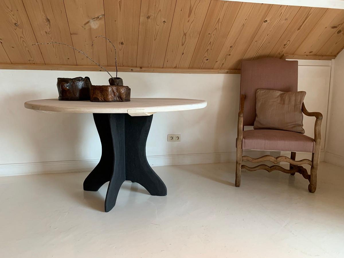 A custom made round table designed and made in our workshop. The Elena model is made from a marble plaster support and a beech top. The beech top consisting of two large slabs of the same tree specifically chosen for its grain and