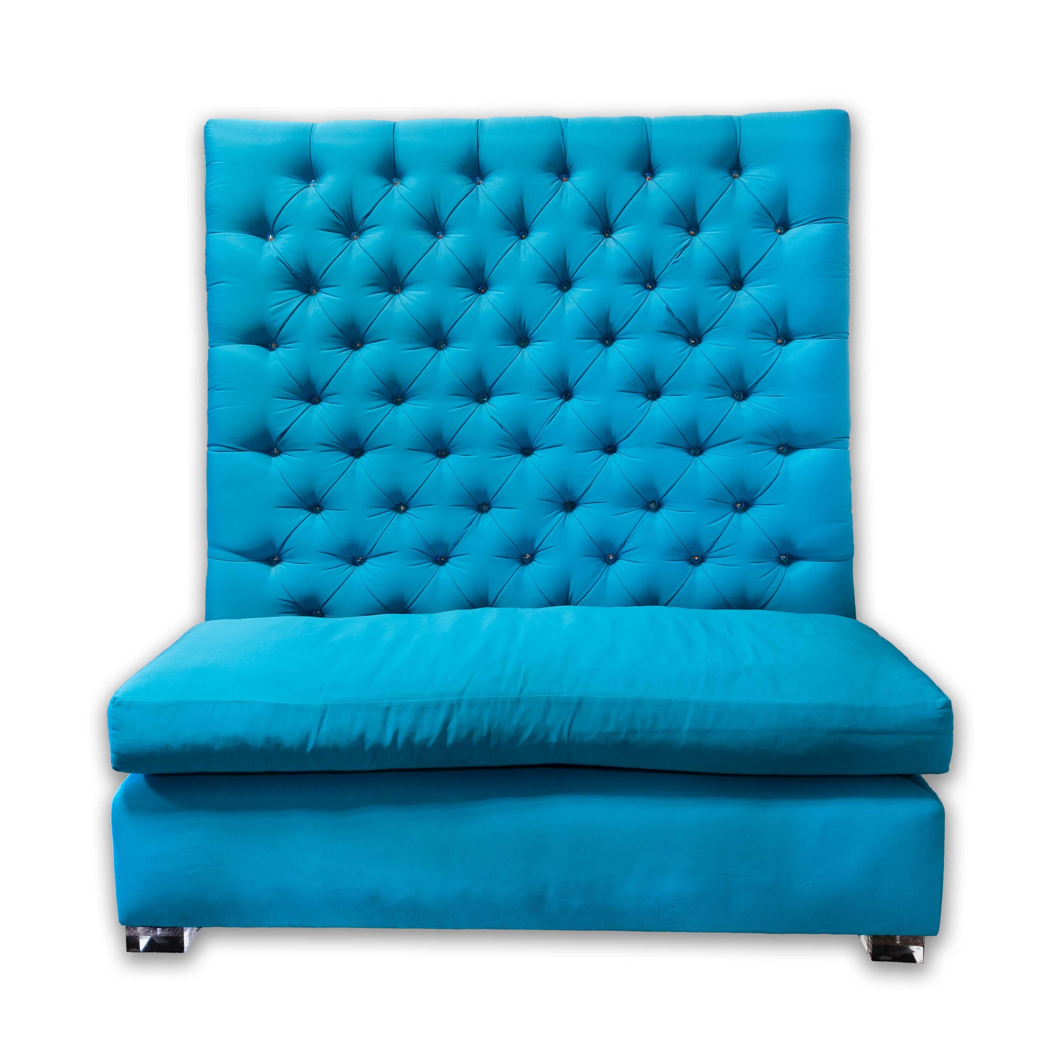 This custom made S. Harris Fabric Tufted Banquette High-Back Loveseat showcases the vibrant Calypso patterning in an eye-catching turquoise hue. The plush tufted high back with gems and generously cushioned seat create an elegant and comfortable